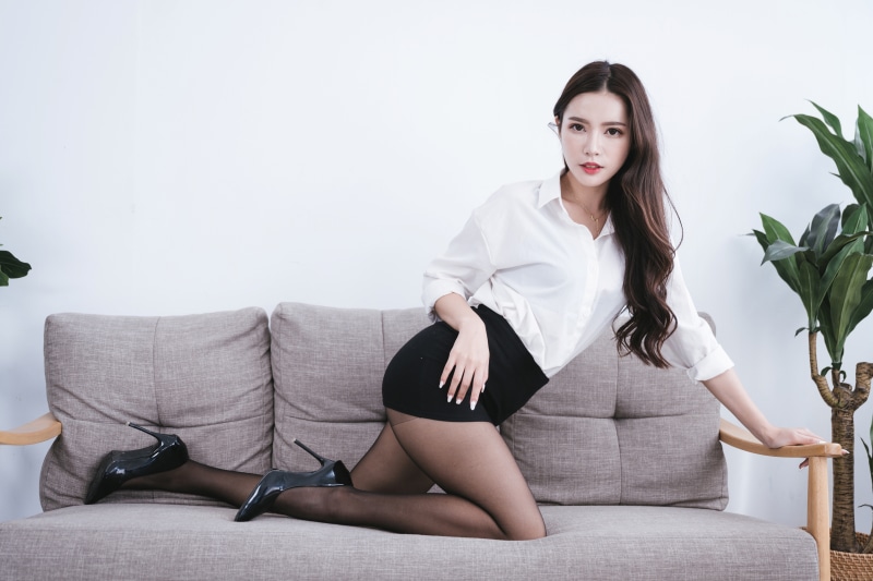 K Asian Sofa Brunette Girl Hands Skirt Legs Stilettos