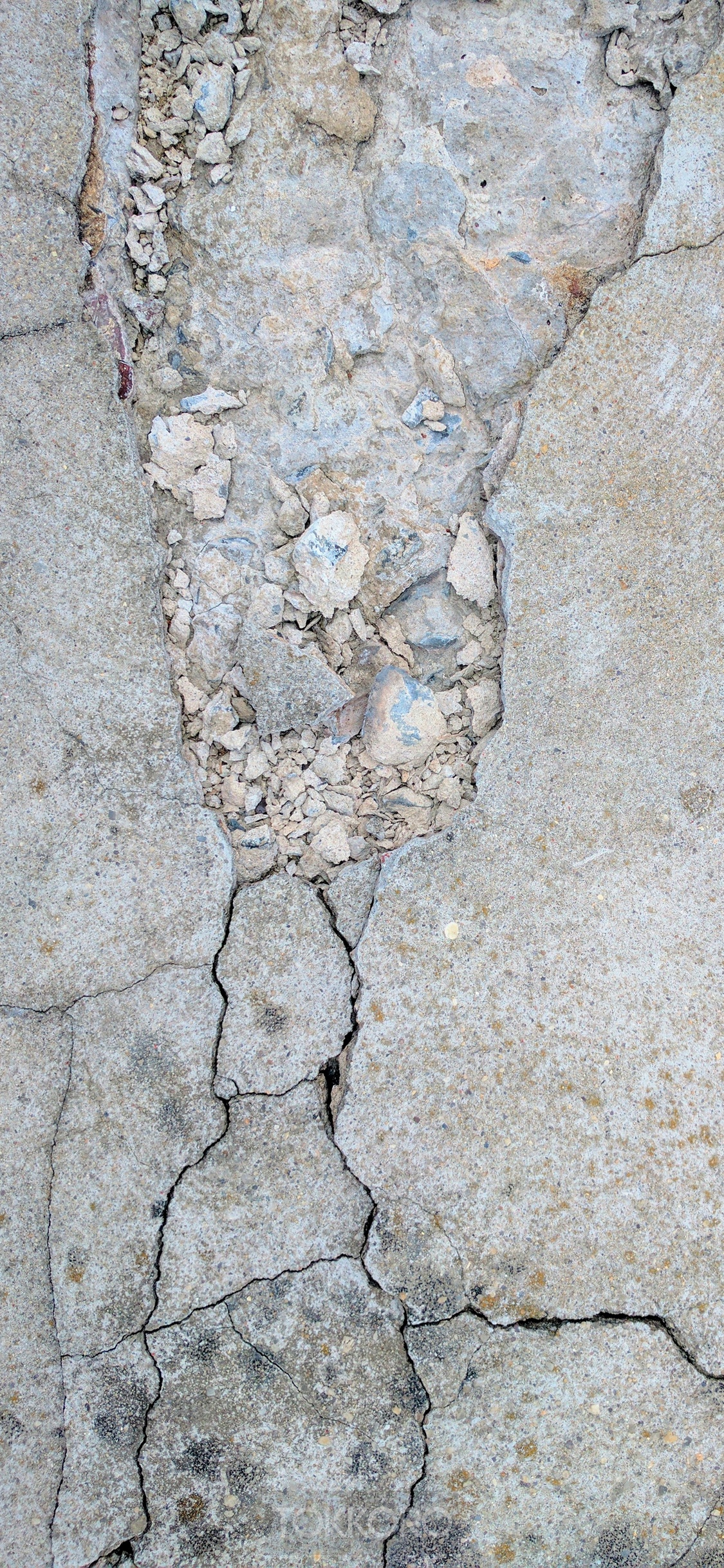 Cracked concrete texture with rubble HD Phone Wallpaper