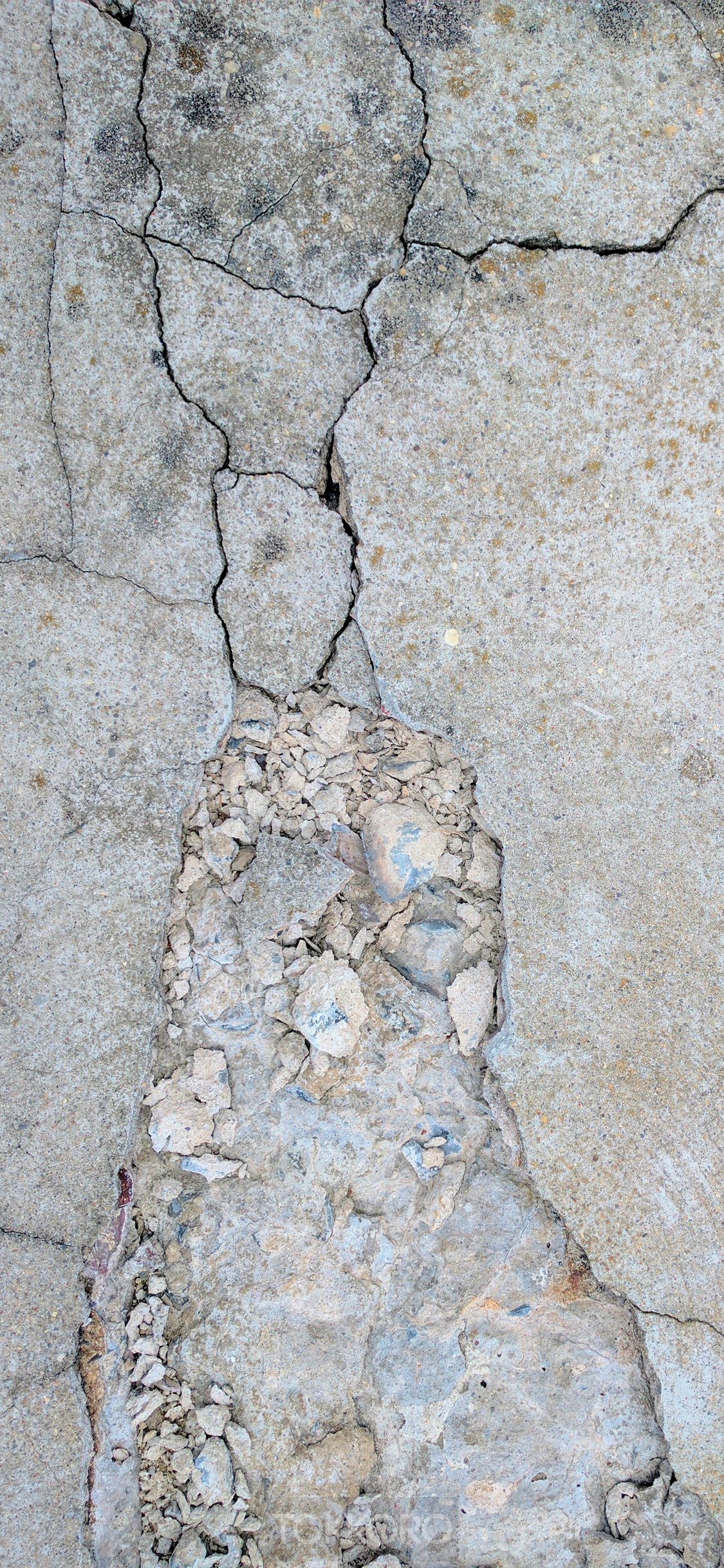 Cracked concrete texture with broken pieces HD Phone Wallpaper