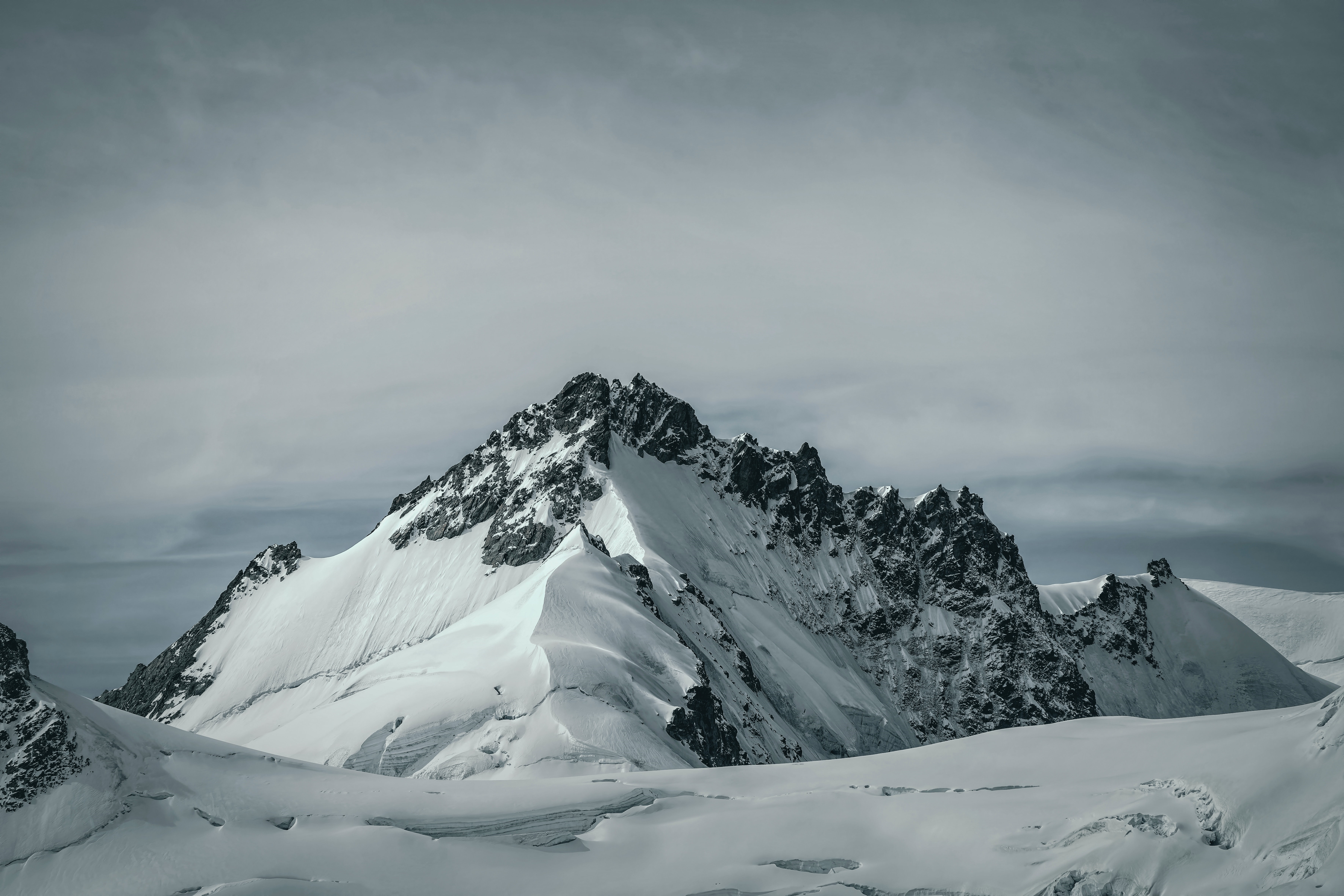 Snowy Mountain Peaks Under Cloudy Sky 4K HD Wallpaper