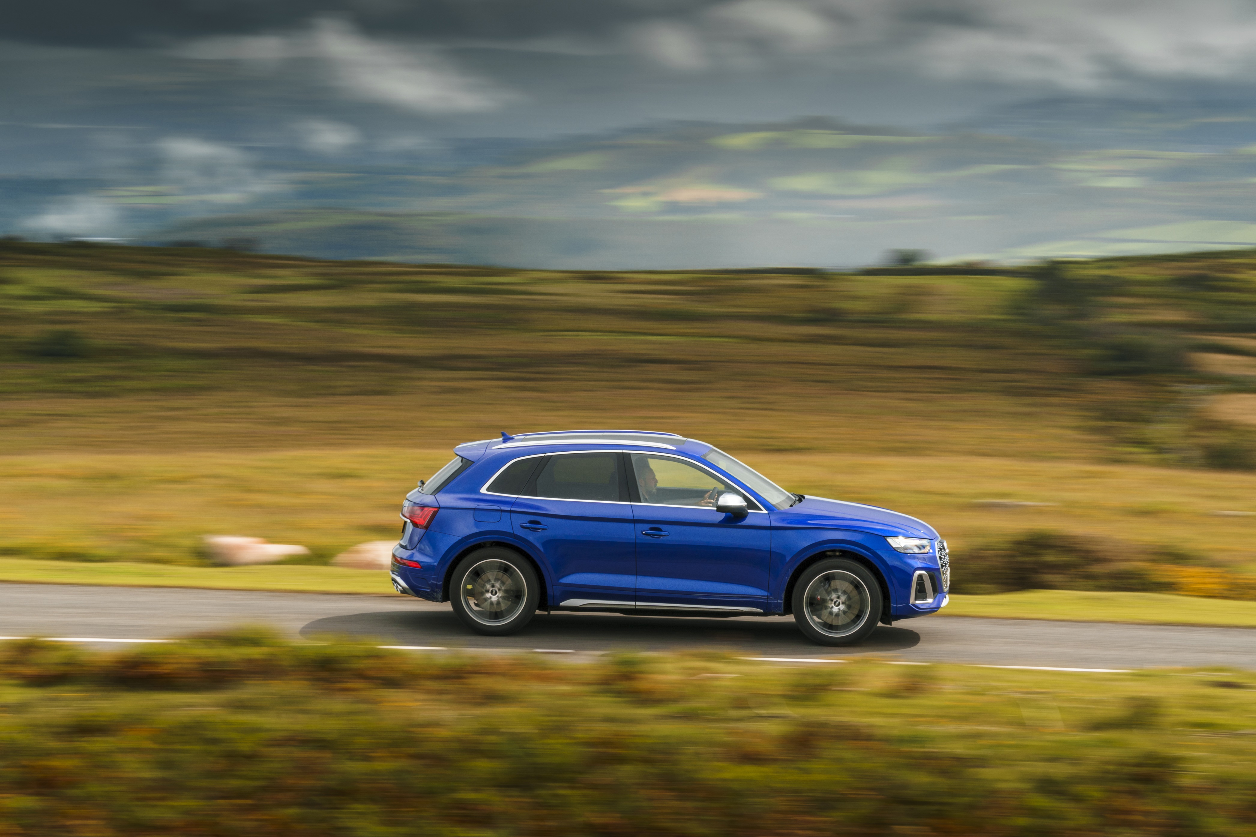 Blue Audi SQ5 TDI 4K SUV driving on a road HD Wallpaper