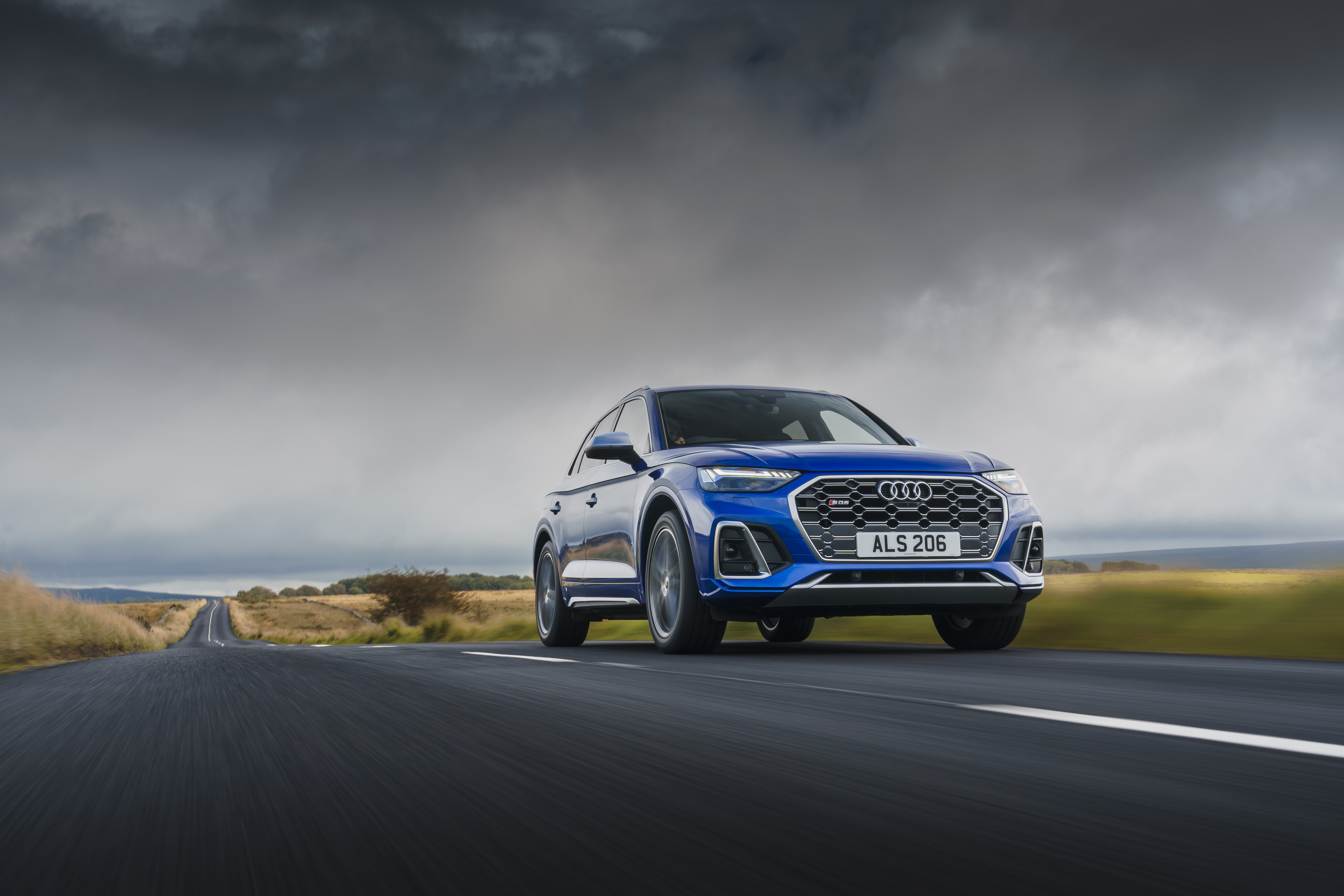 Blue Audi SQ5 TDI 4K SUV driving on a road HD Wallpaper