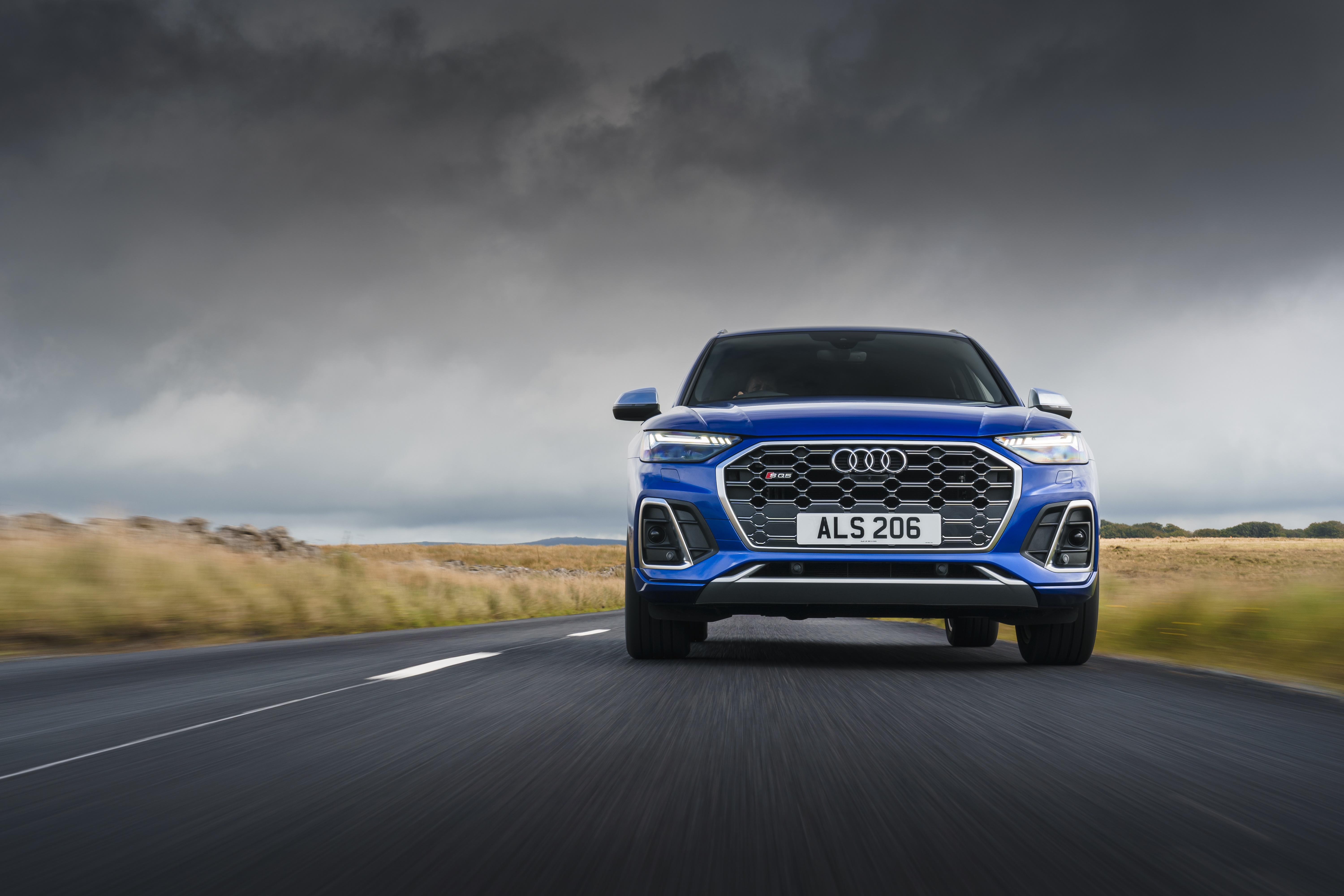 Blue Audi SQ5 TDI 4K driving on a road HD Wallpaper