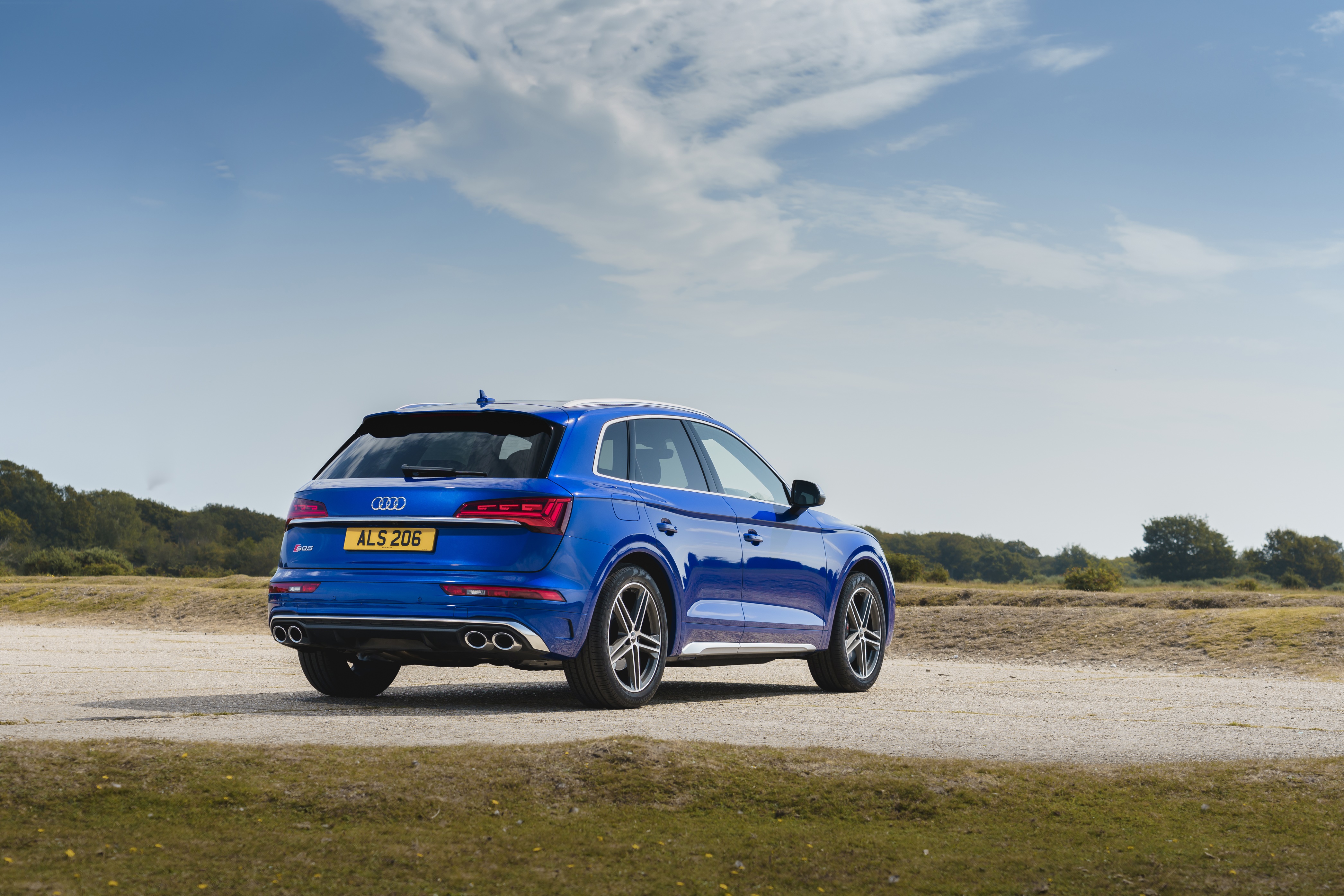 Blue Audi SQ5 TDI 4K SUV on a dirt road HD Wallpaper