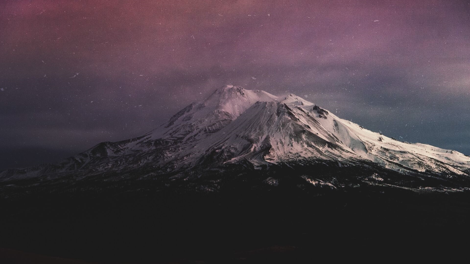Snow-capped mountains under a starry night sky HD Wallpaper