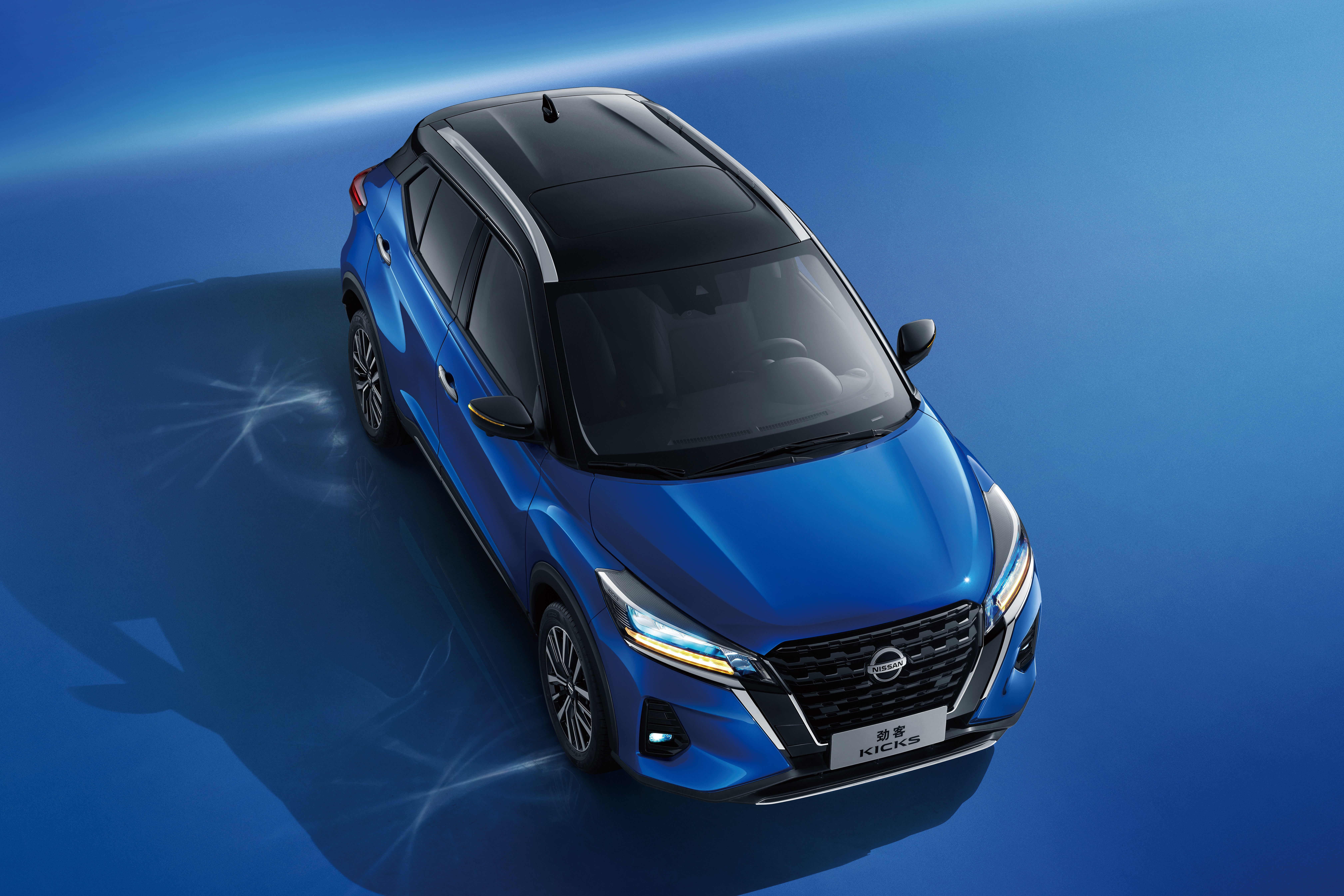 Blue Nissan Kicks SUV from above HD Wallpaper