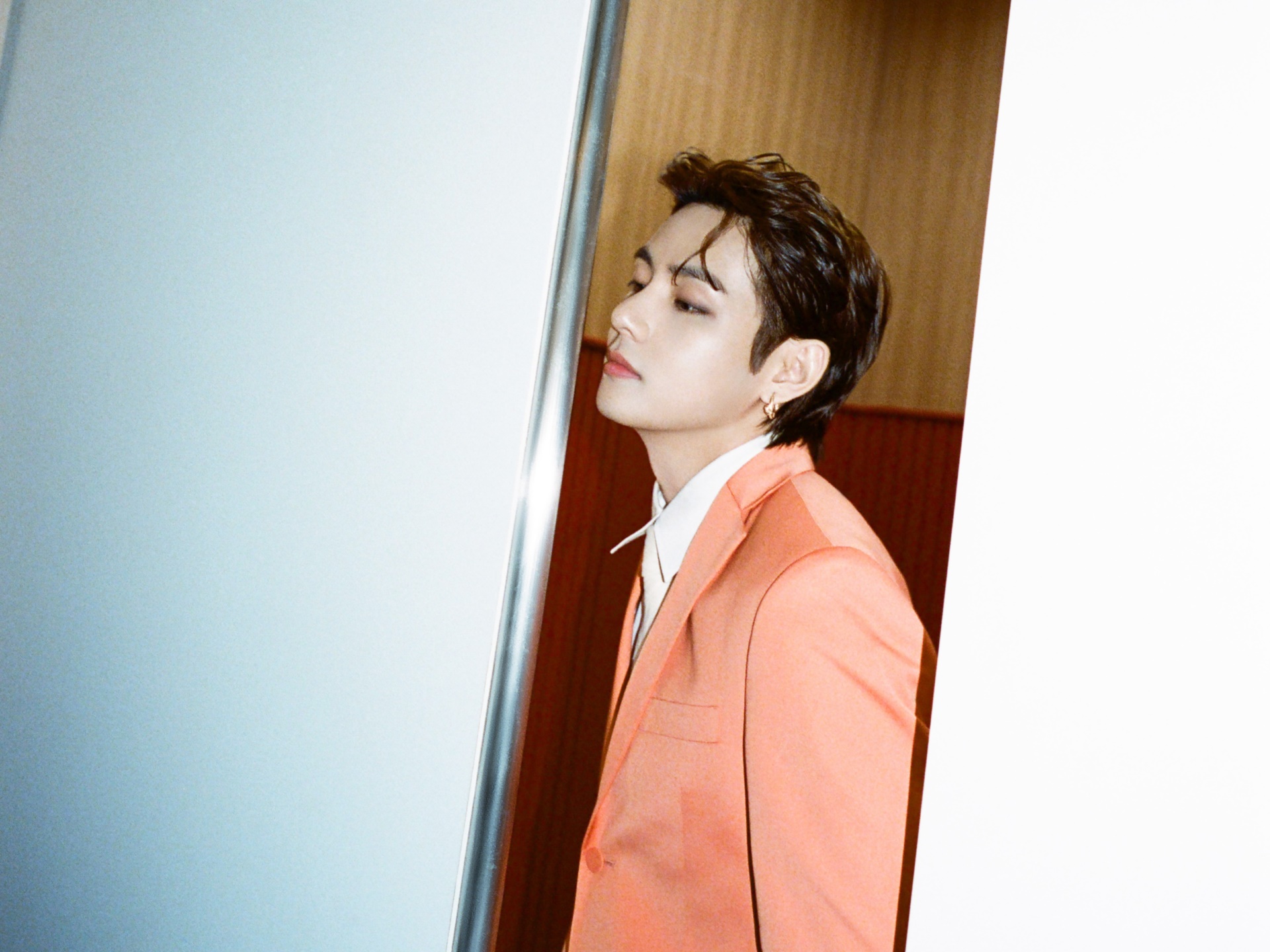 V from BTS in a peach suit HD Wallpaper