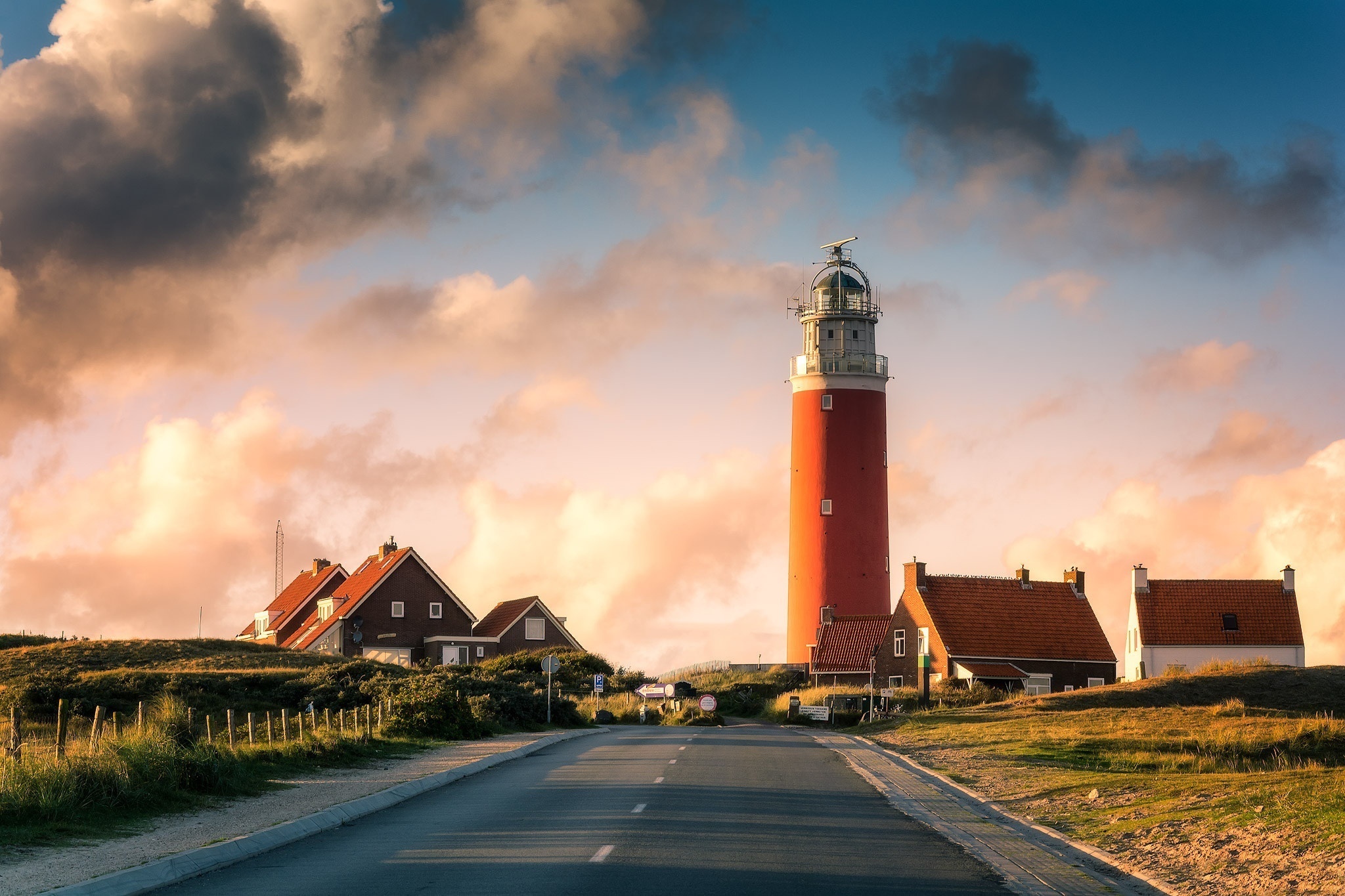 Red lighthouse and houses in Netherlands HD Wallpaper