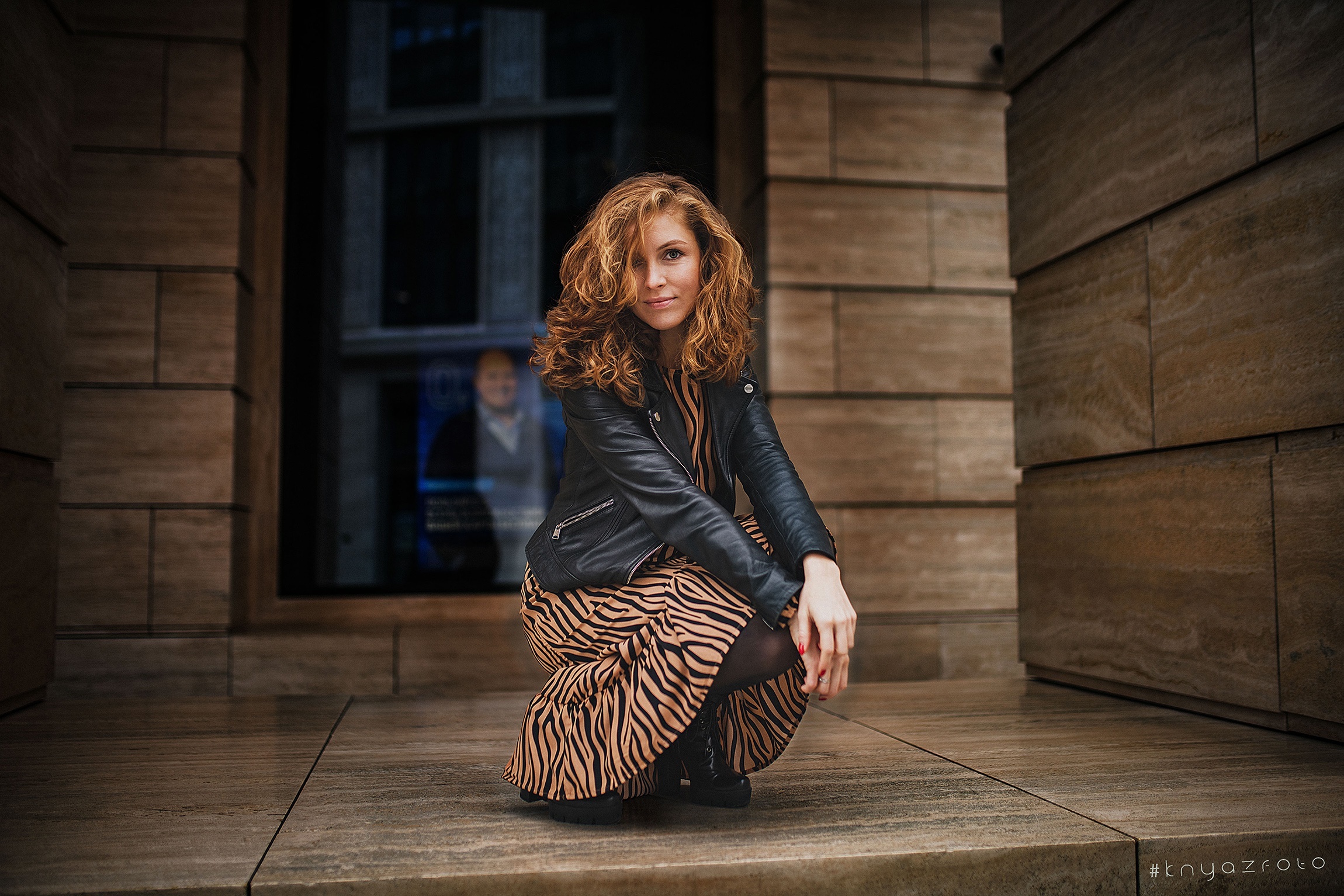 Redhead woman in leather jacket and zebra print dress HD Wallpaper