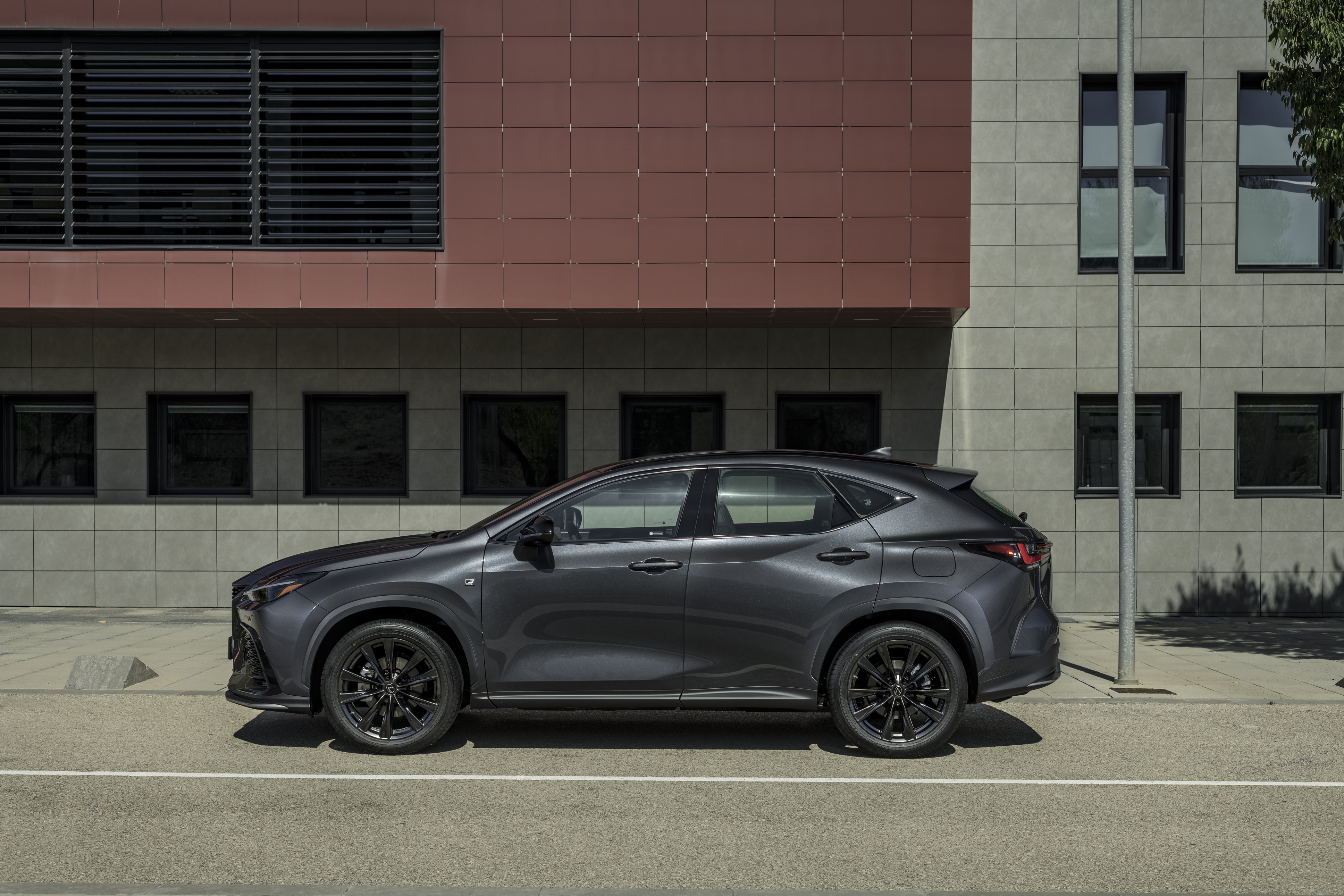 Lexus NX 350 F SPORT parked by a modern building HD Wallpaper