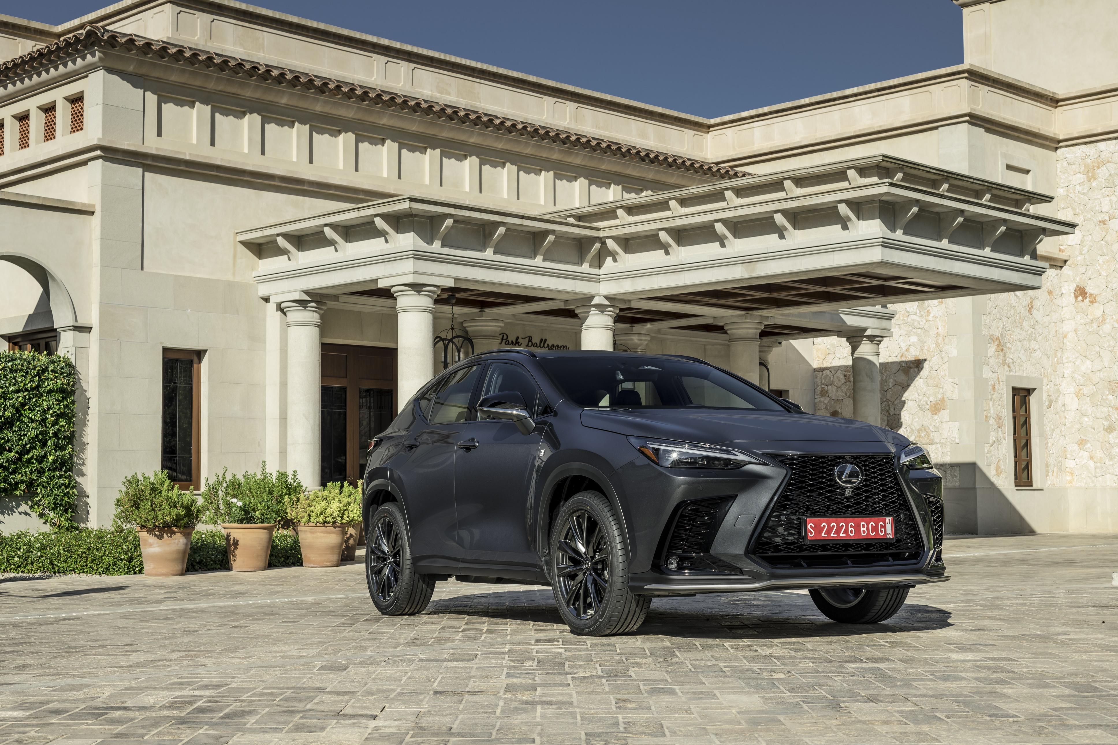 Lexus NX 350 F SPORT parked in front of a building HD Wallpaper