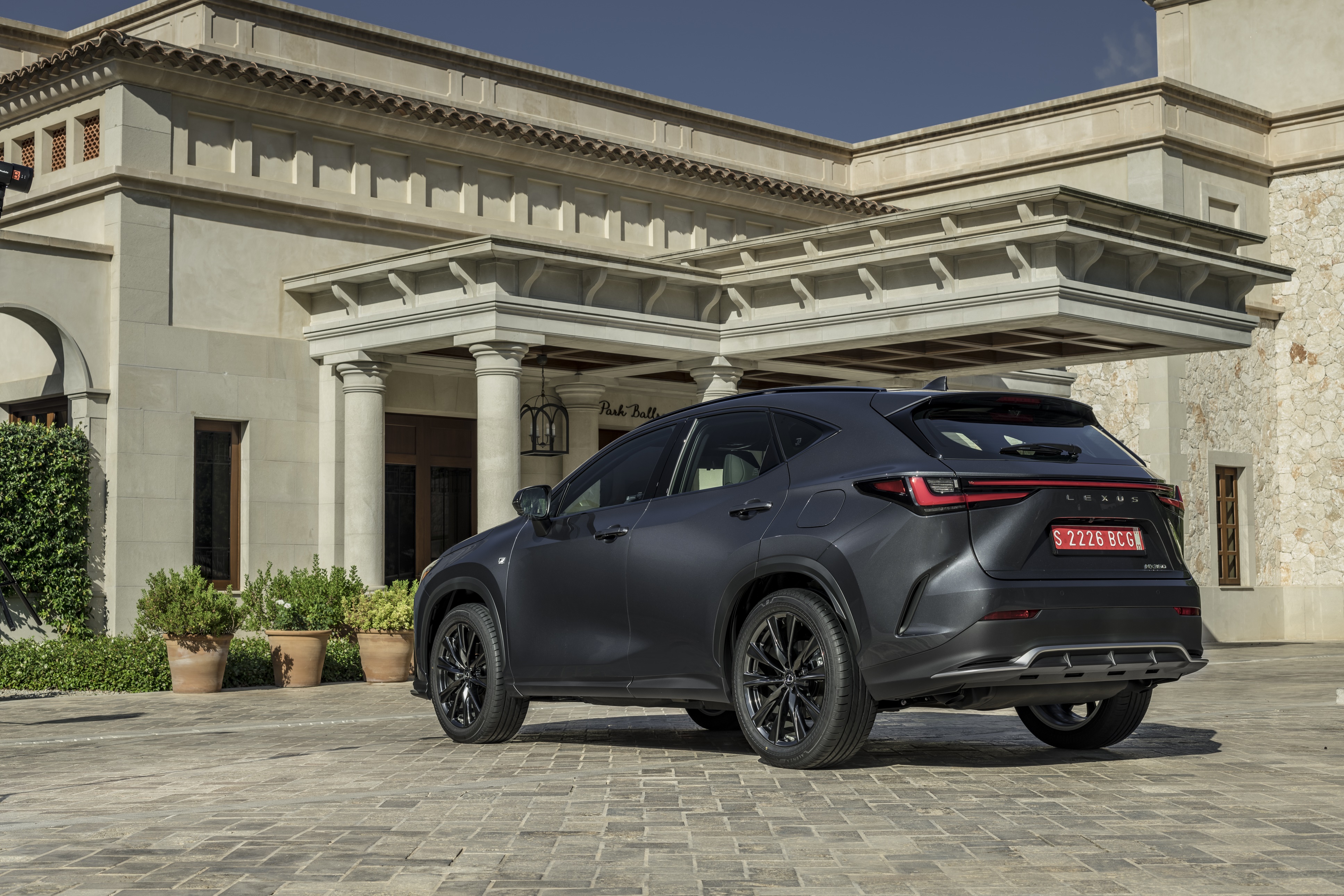 Lexus NX 350 F SPORT parked in front of a building HD Wallpaper