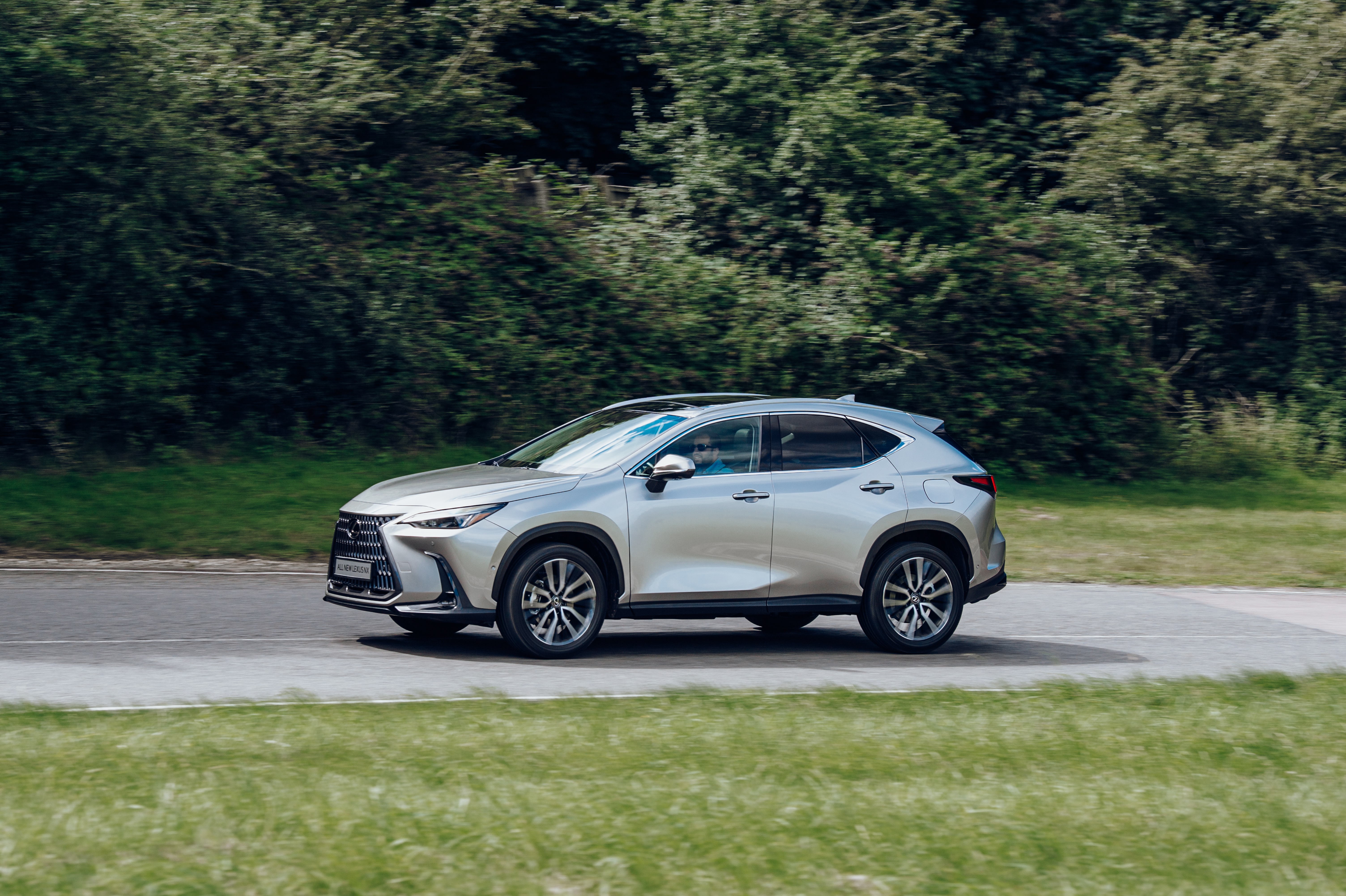 Silver Lexus NX 350 4K driving on a road HD Wallpaper