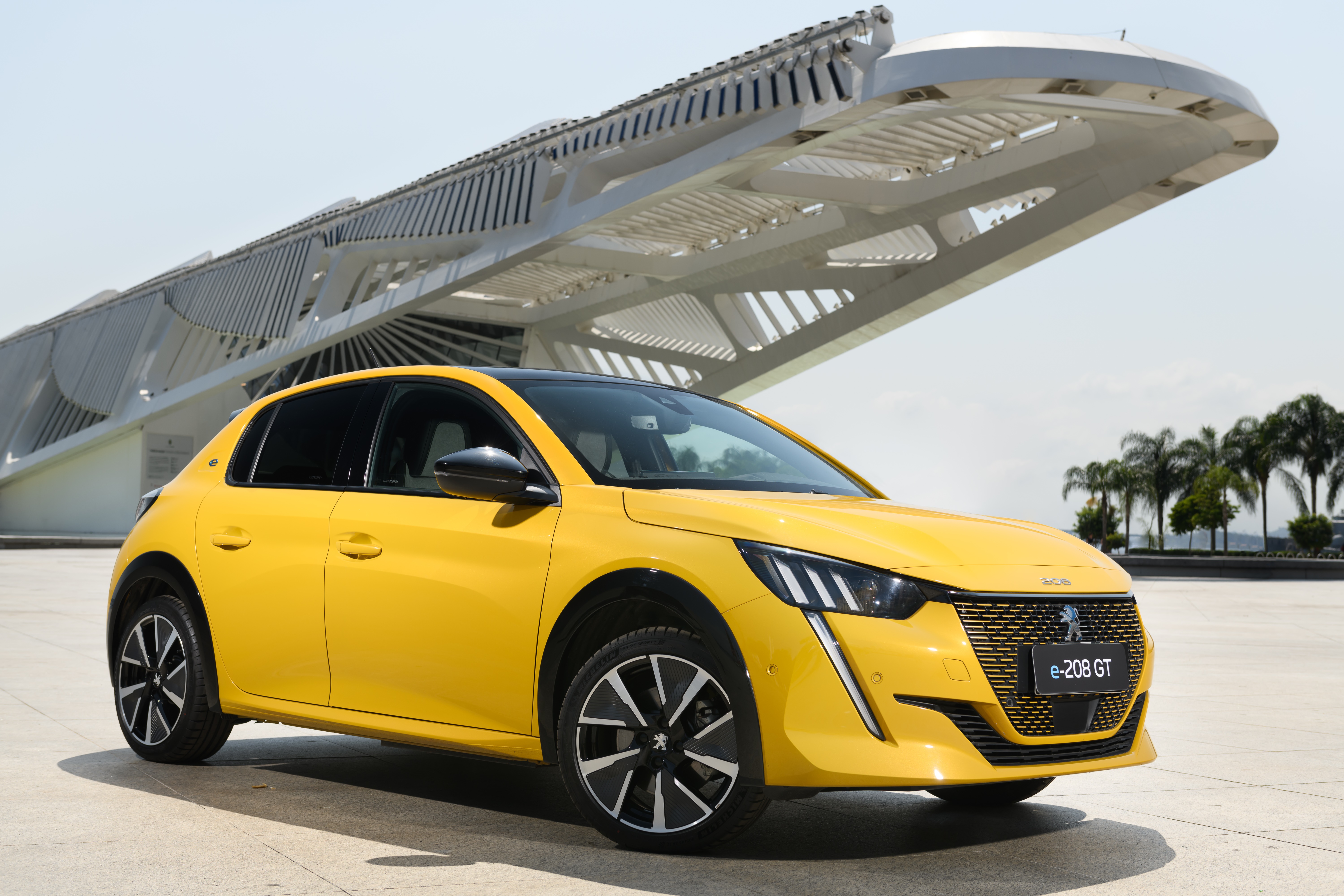 Yellow Peugeot e-208 GT electric car HD Wallpaper