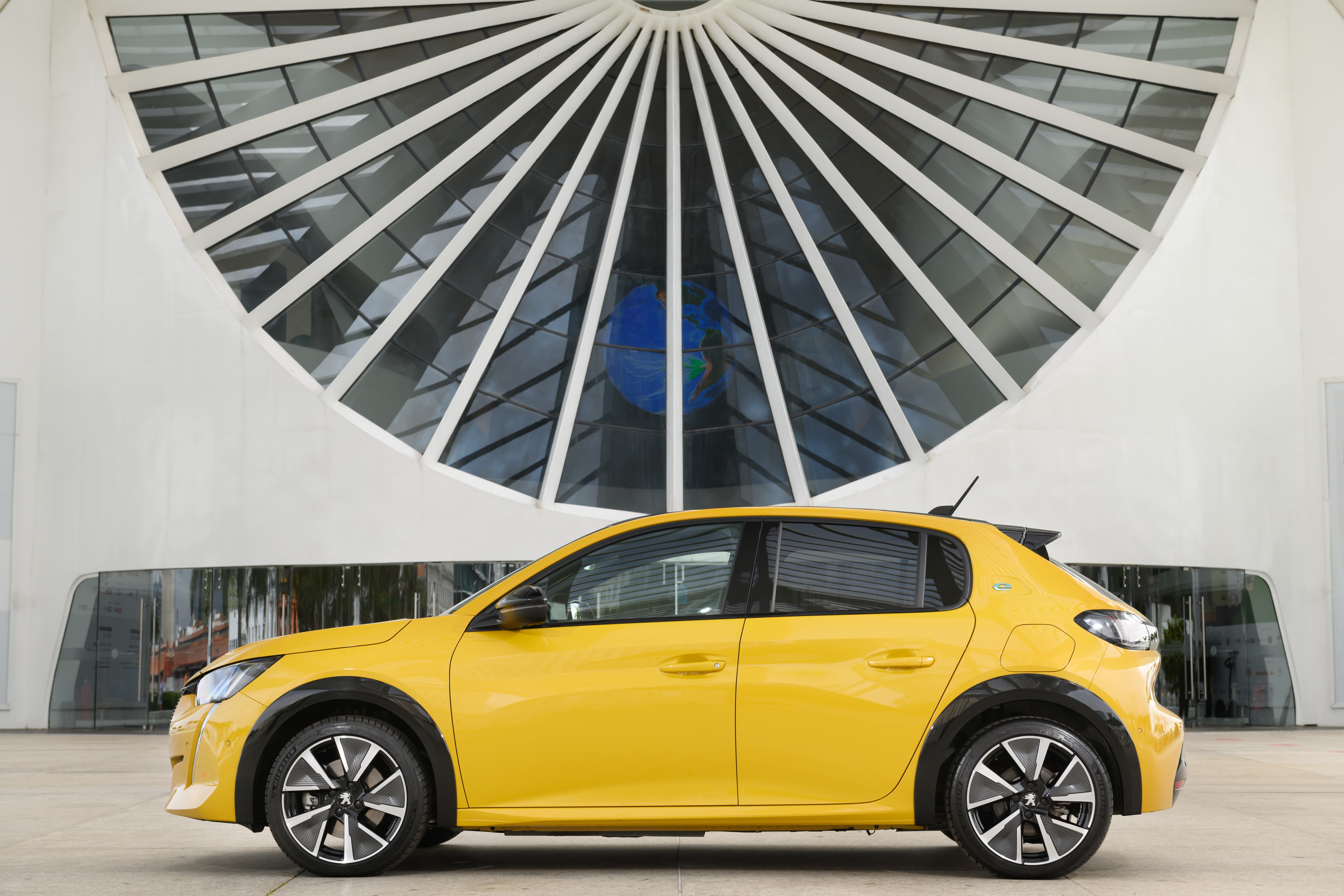 Yellow Peugeot E-208 GT electric car HD Wallpaper