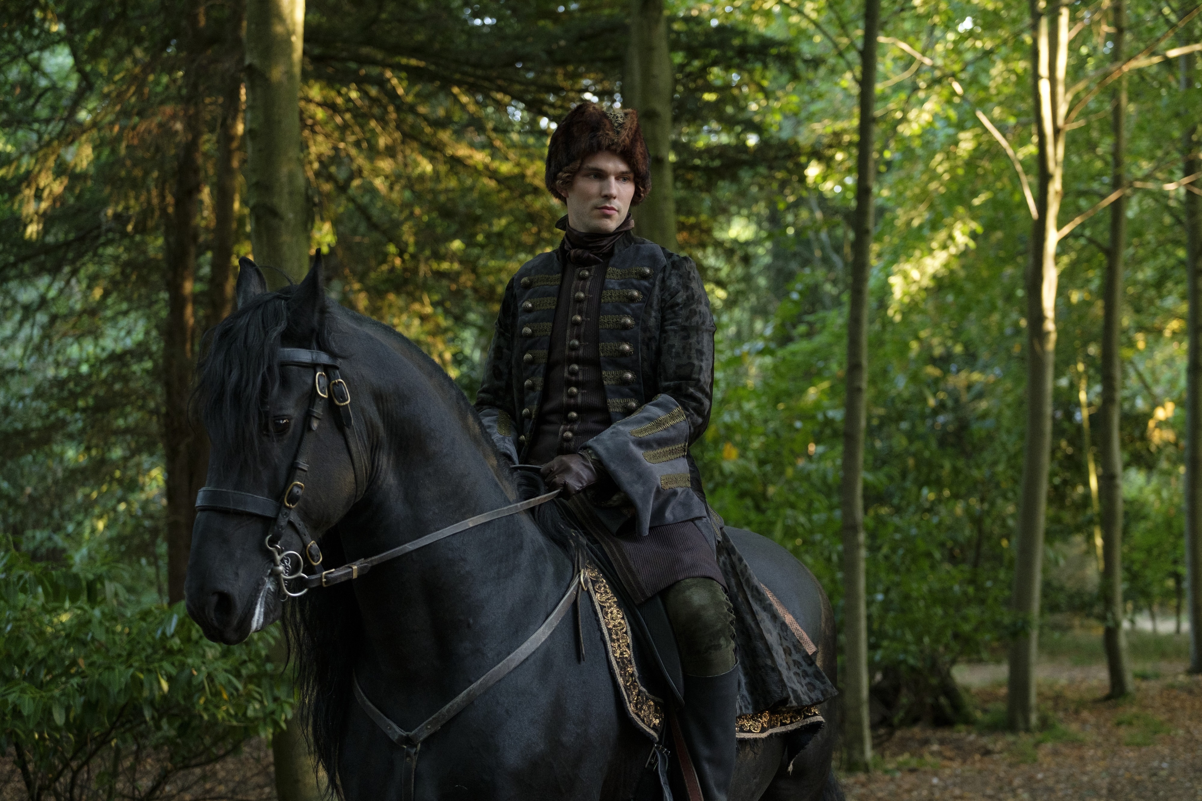 Nicholas Hoult on a horse in a forest HD Wallpaper