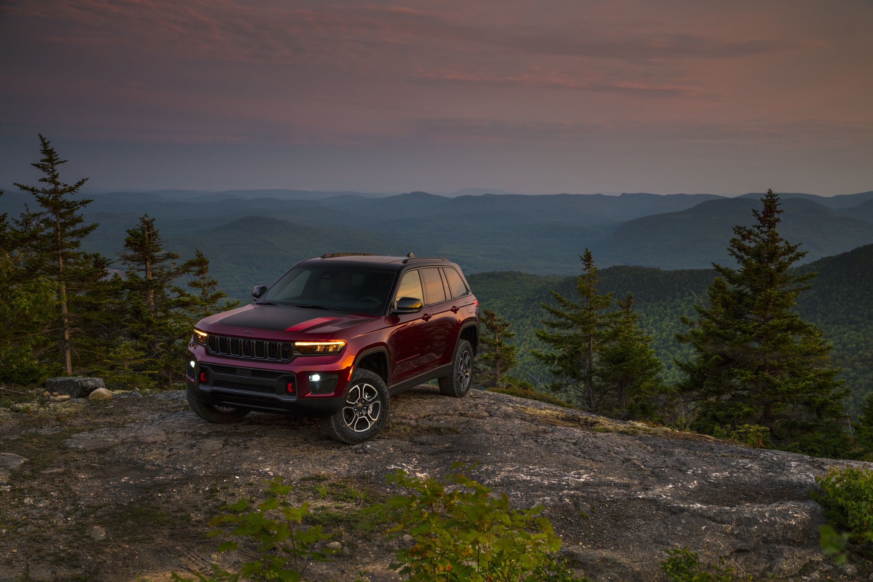 2022 Jeep Grand Cherokee Trailhawk on a mountain overlook HD Wallpaper