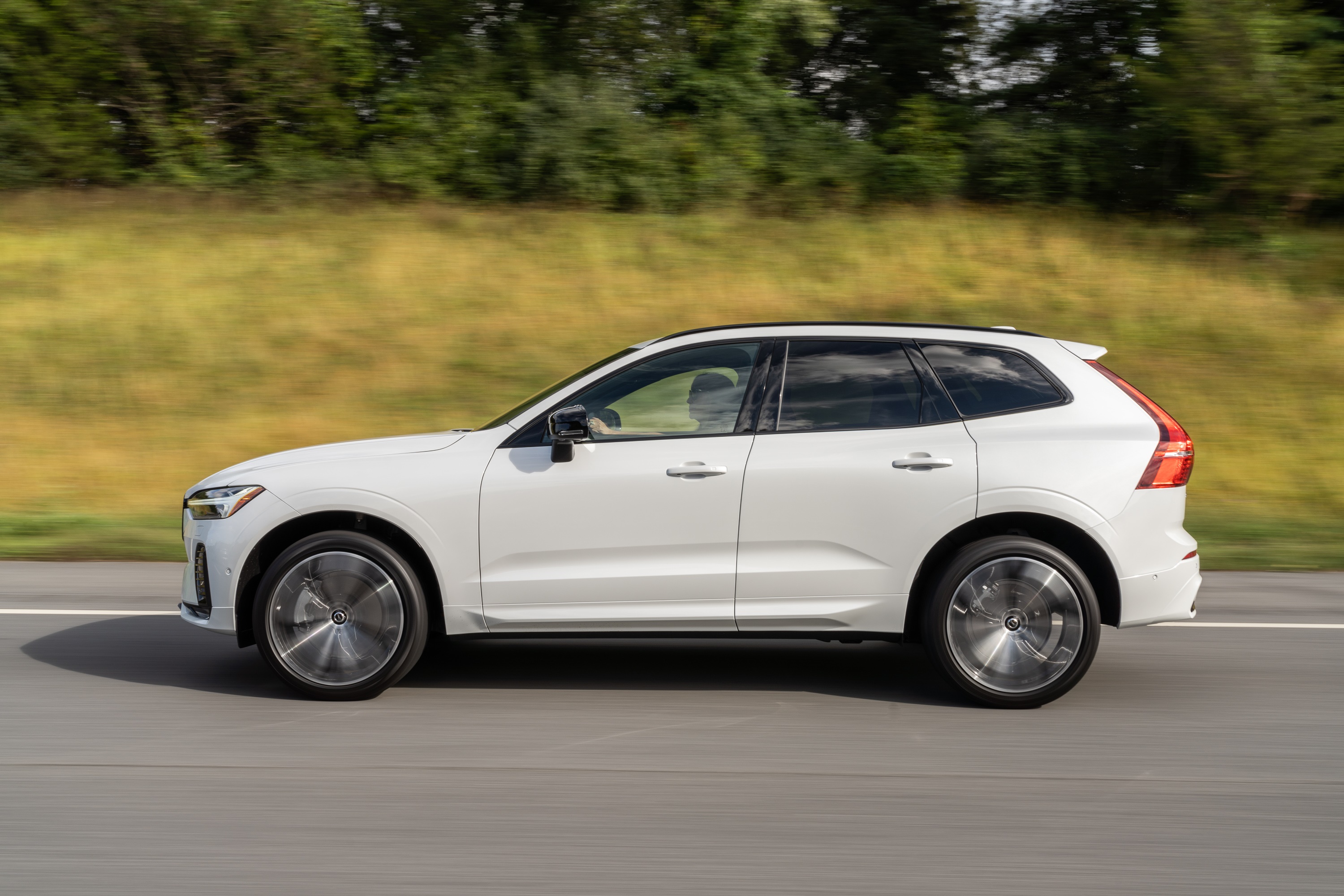 White Volvo XC60 B6 AWD driving on a road HD Wallpaper