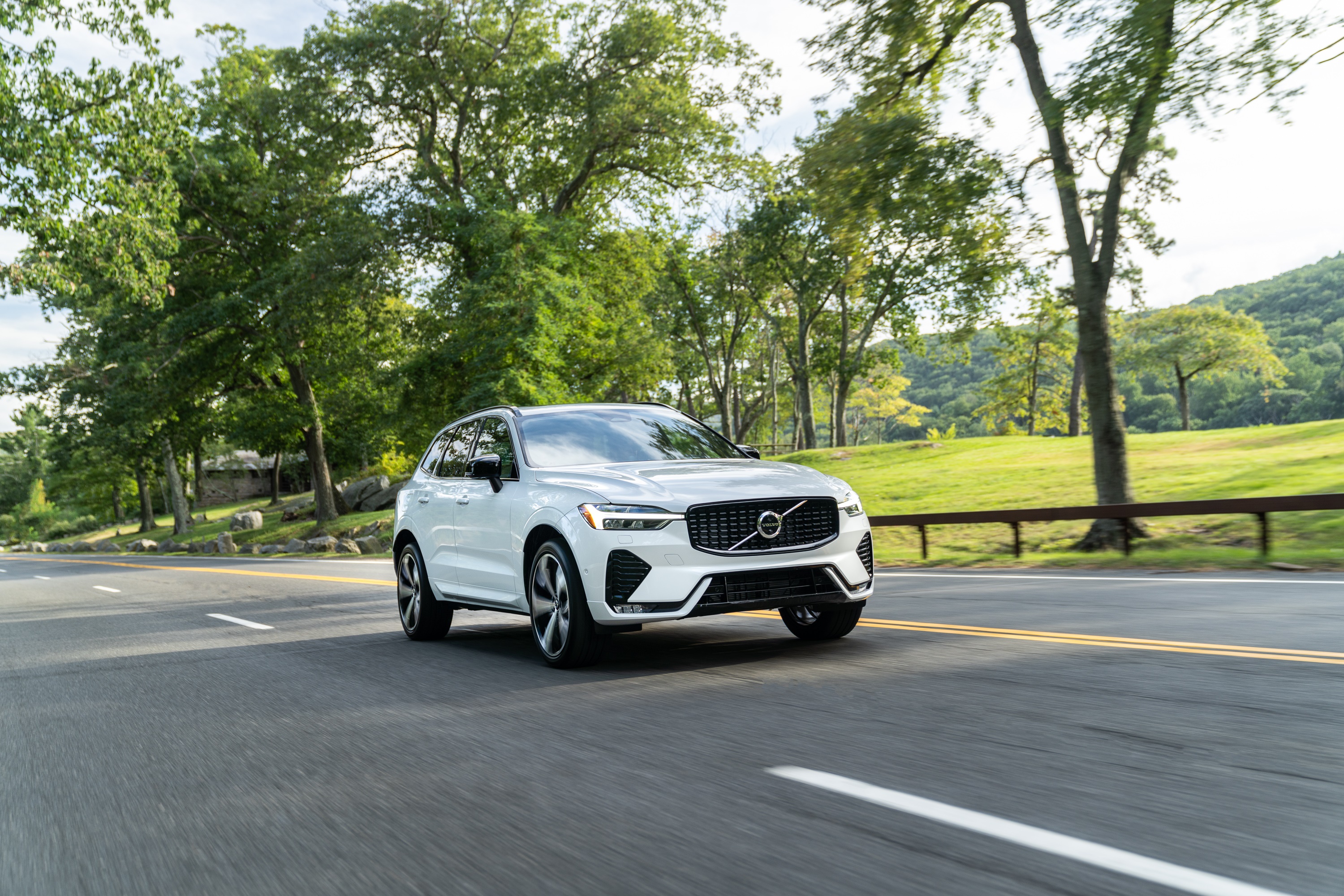 White Volvo XC60 B6 AWD driving on a road HD Wallpaper