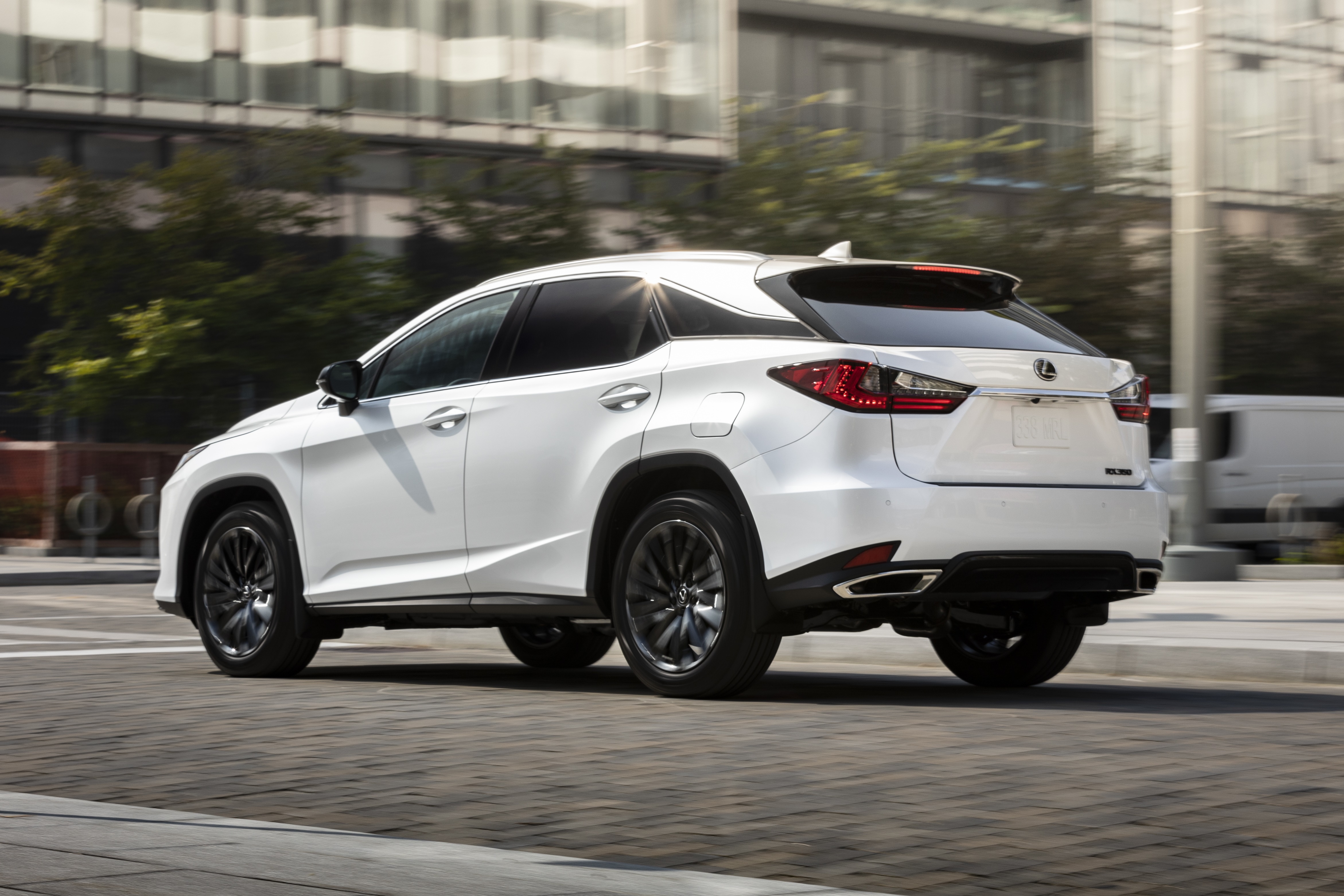 White Lexus RX 350 SUV driving on street HD Wallpaper