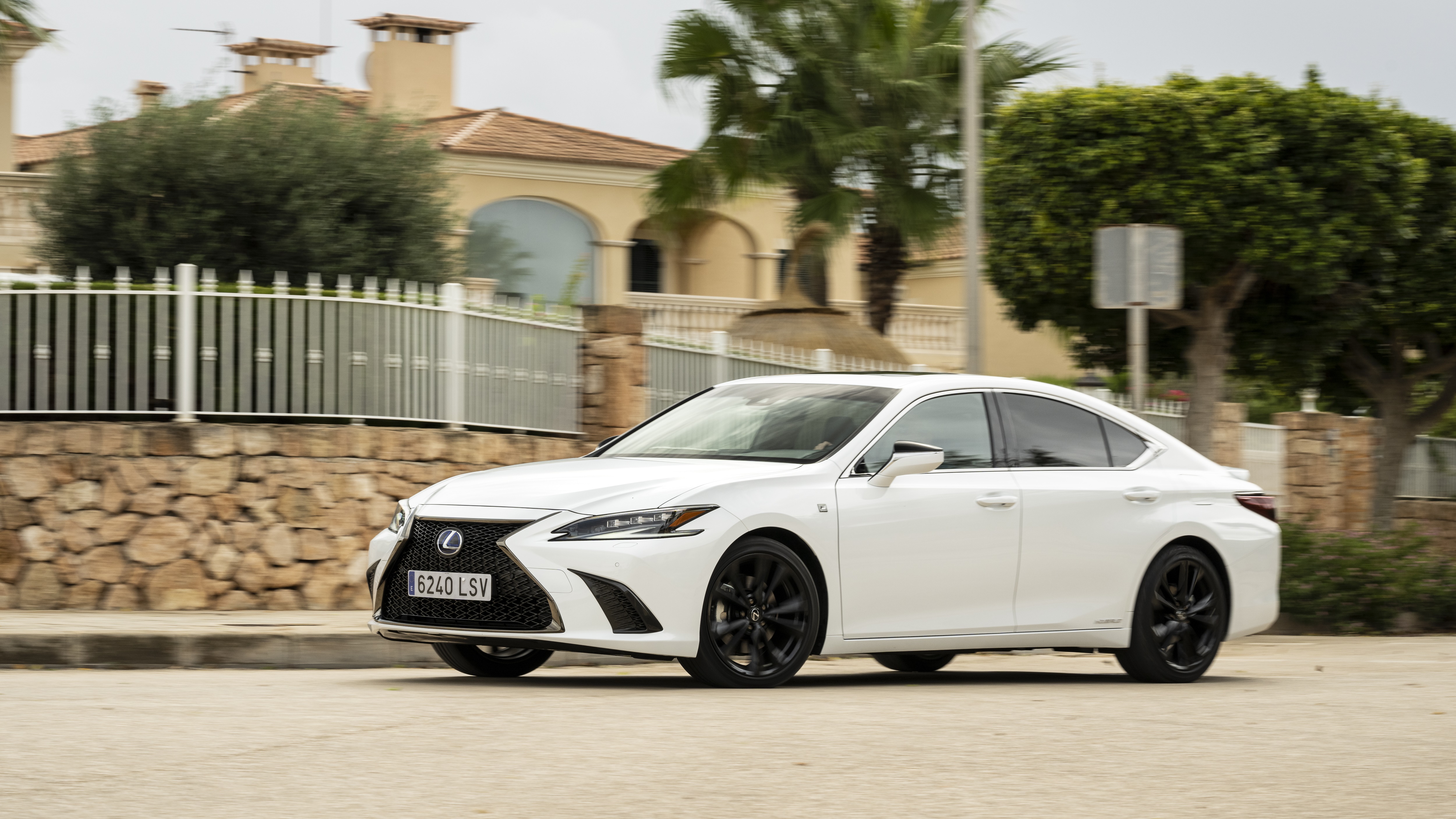White Lexus ES 300h F SPORT driving on a street HD Wallpaper