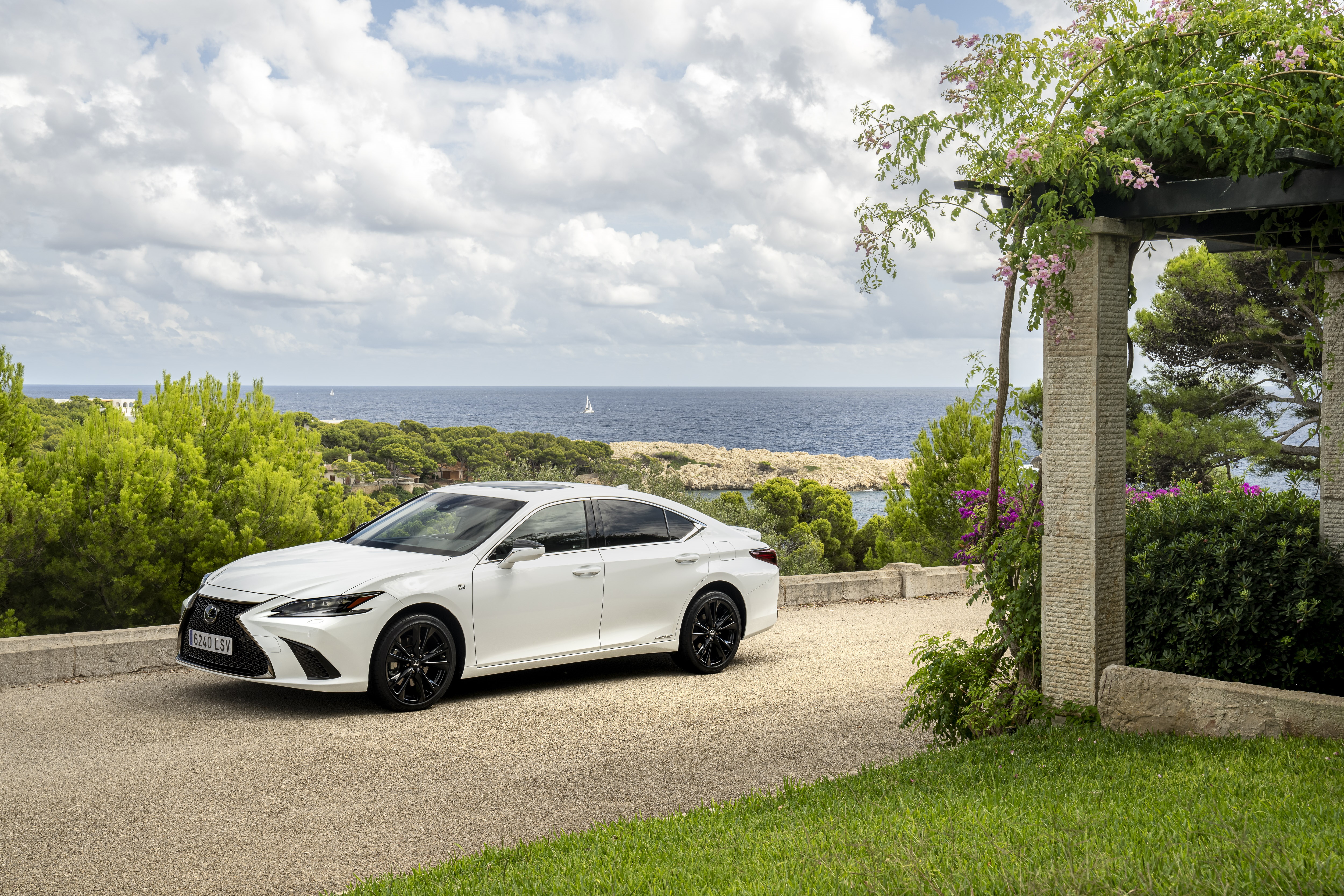 White Lexus ES 300h F SPORT parked by the sea HD Wallpaper
