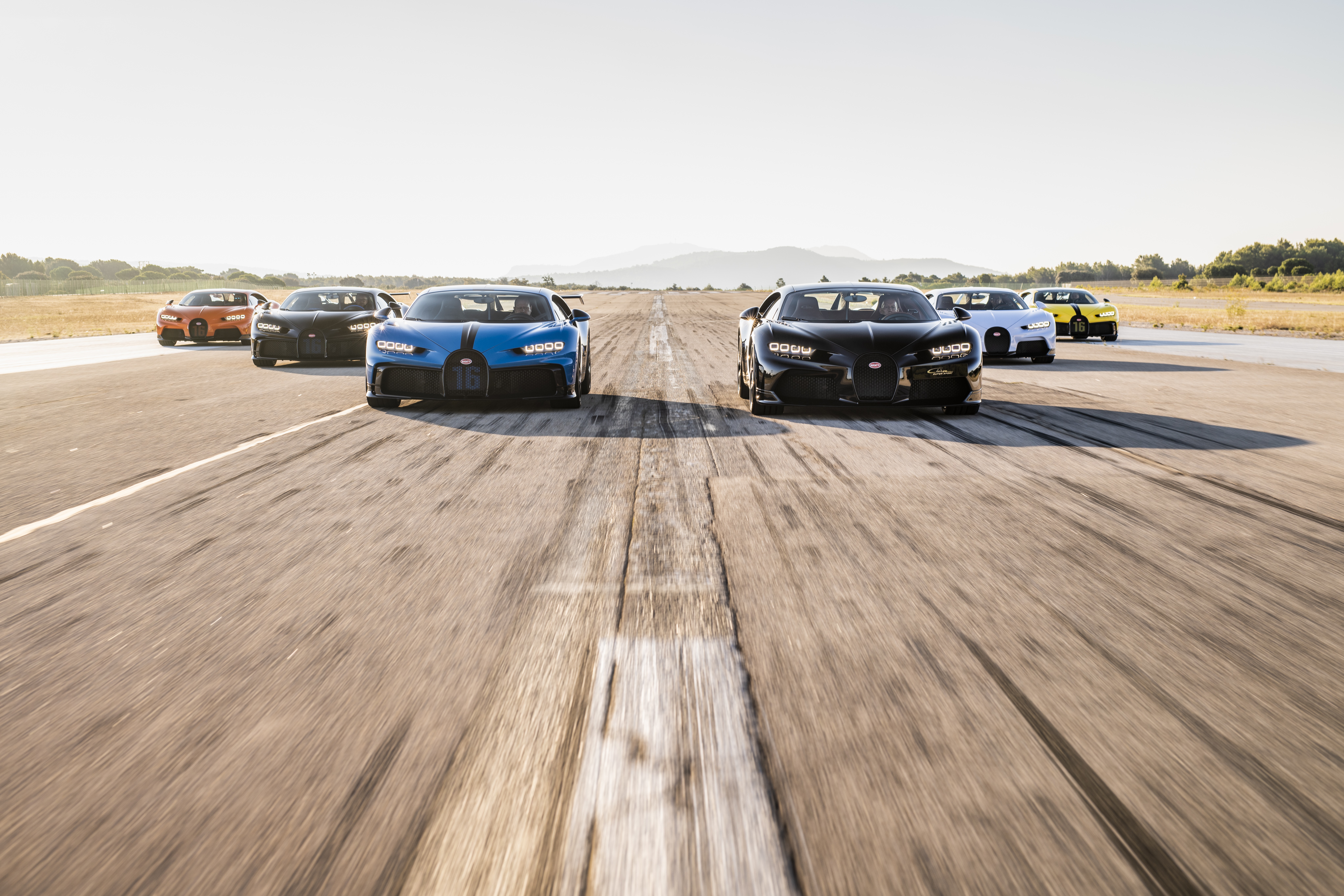 Bugatti Chiron Supercars on a Racetrack HD Wallpaper
