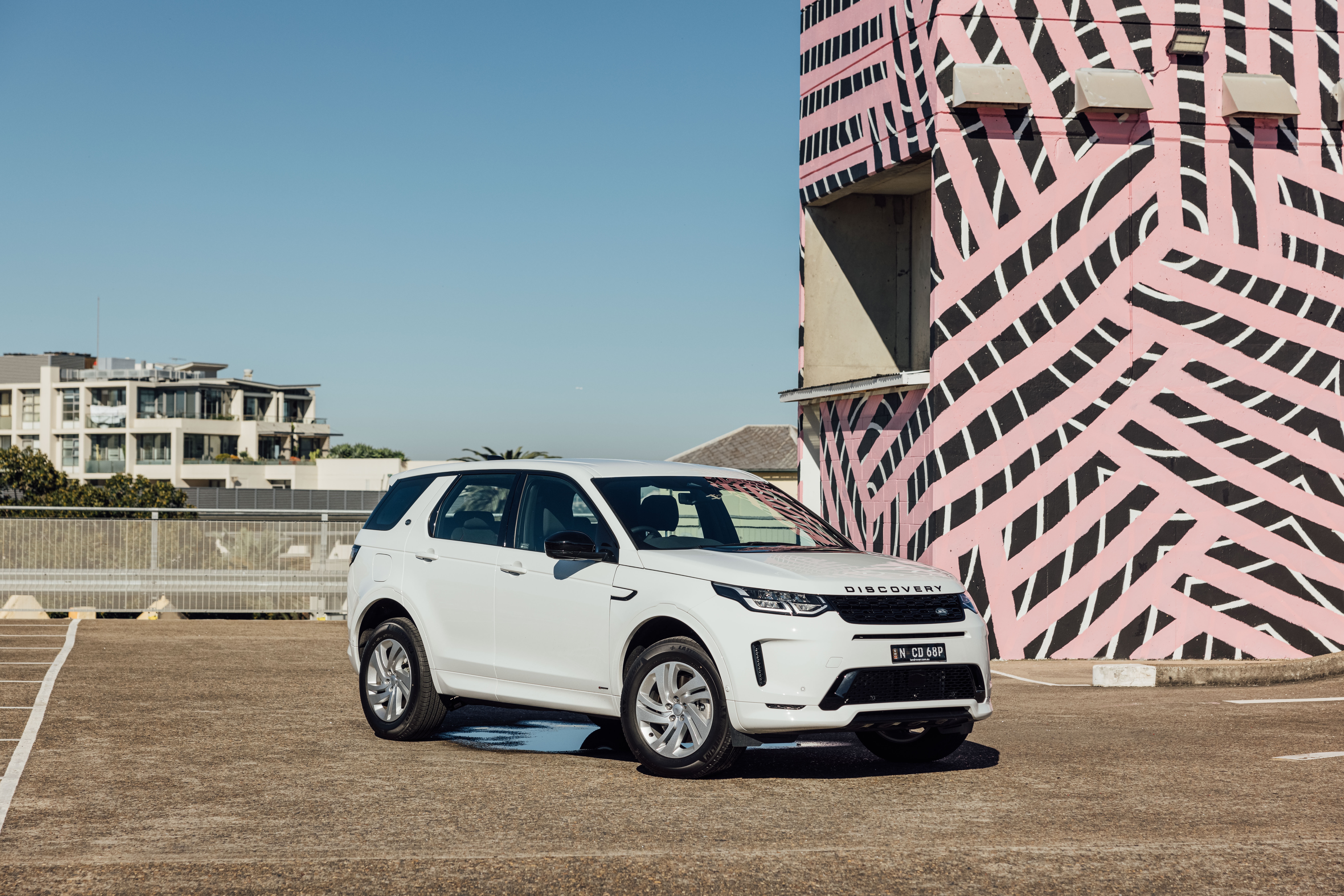 White Land Rover Discovery Sport SUV parked outdoors HD Wallpaper