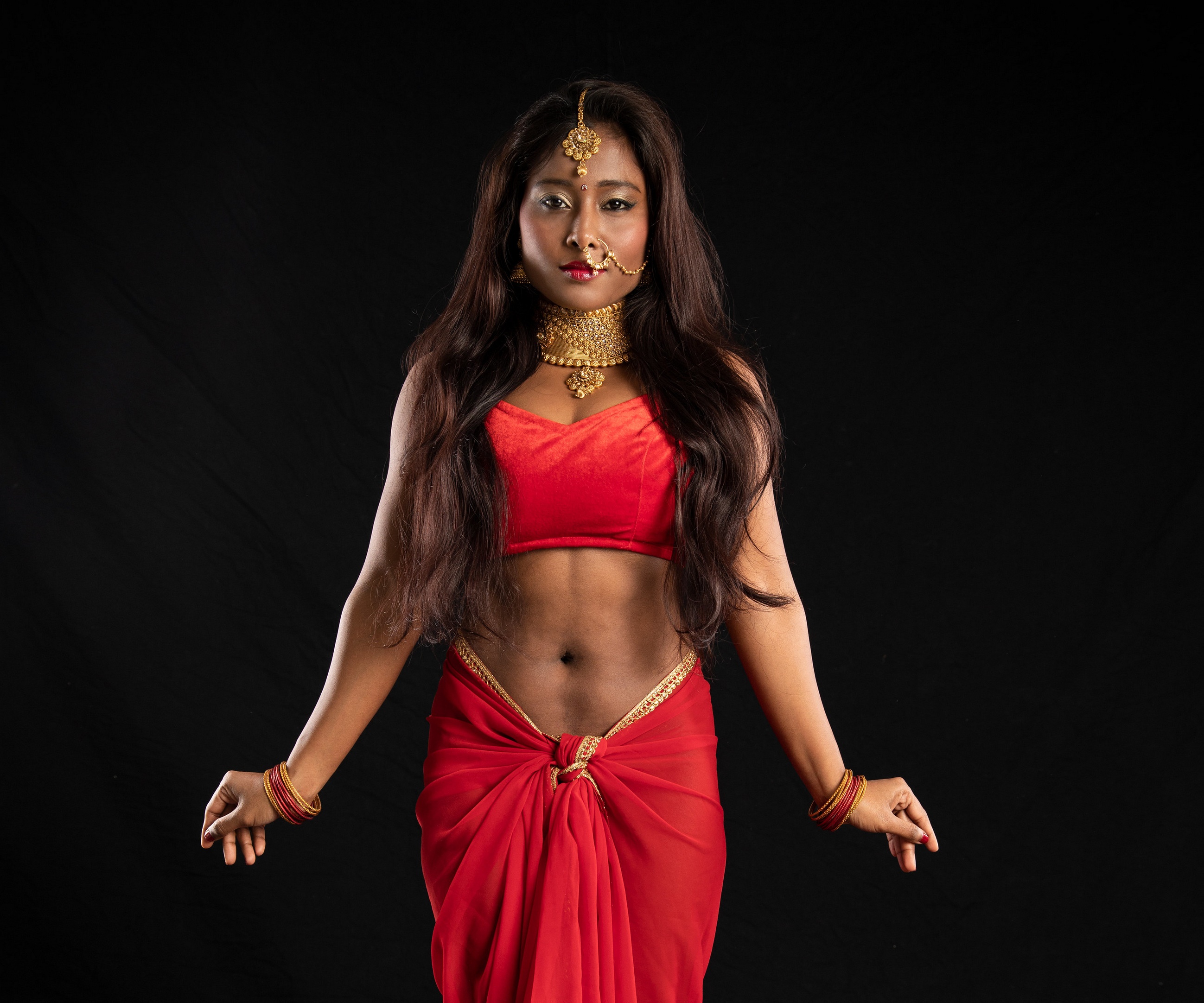 Woman in Red Sari with Traditional Jewelry HD Wallpaper