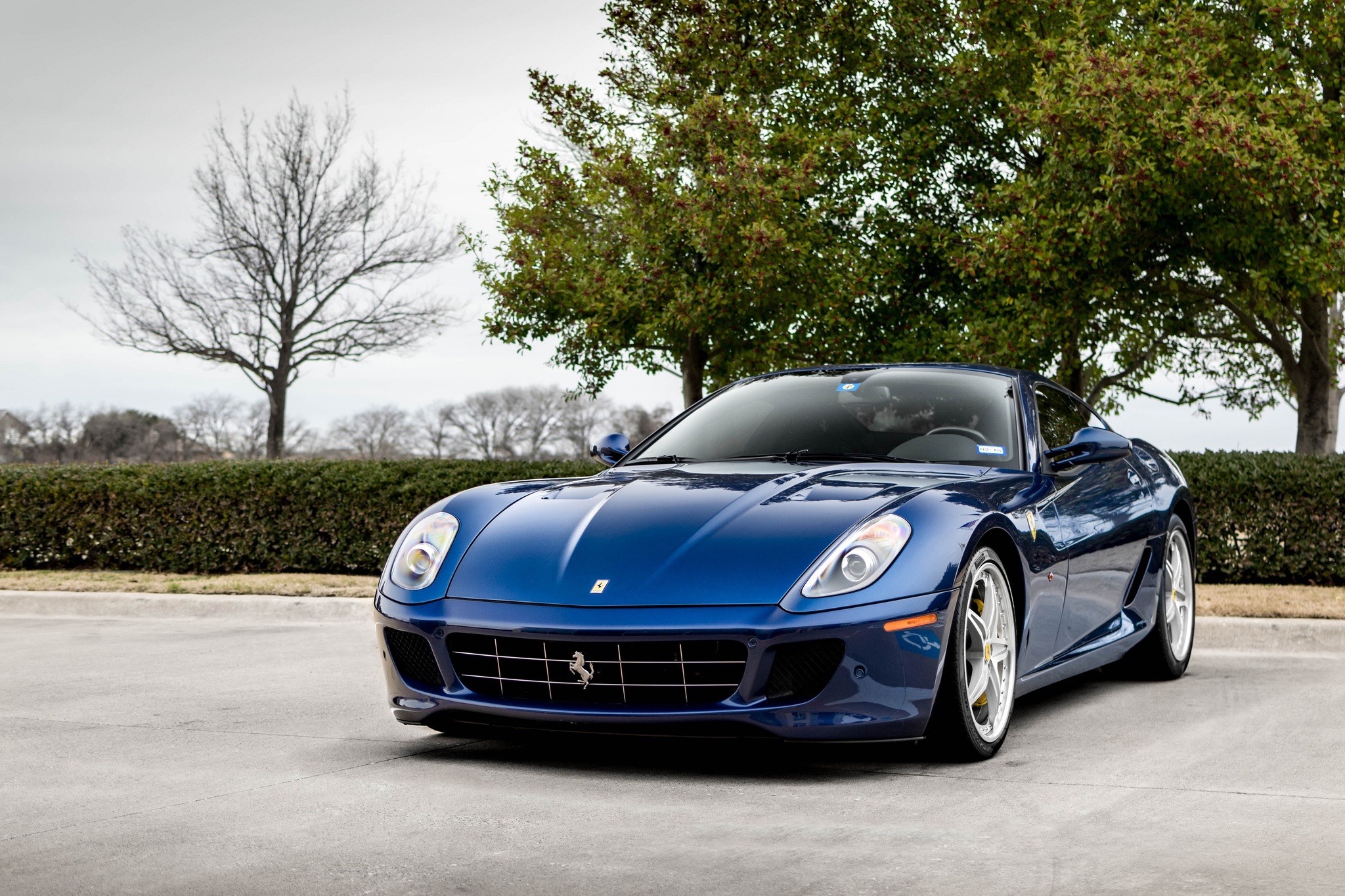 Blue Ferrari 599 GTB parked outdoors HD Wallpaper