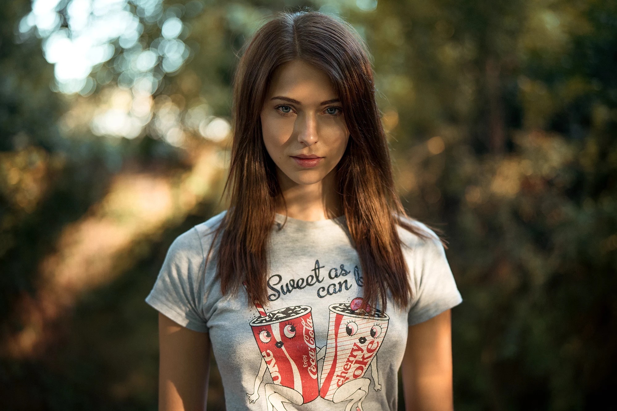 Brunette woman wearing a t-shirt with Coca-Cola graphics HD Wallpaper