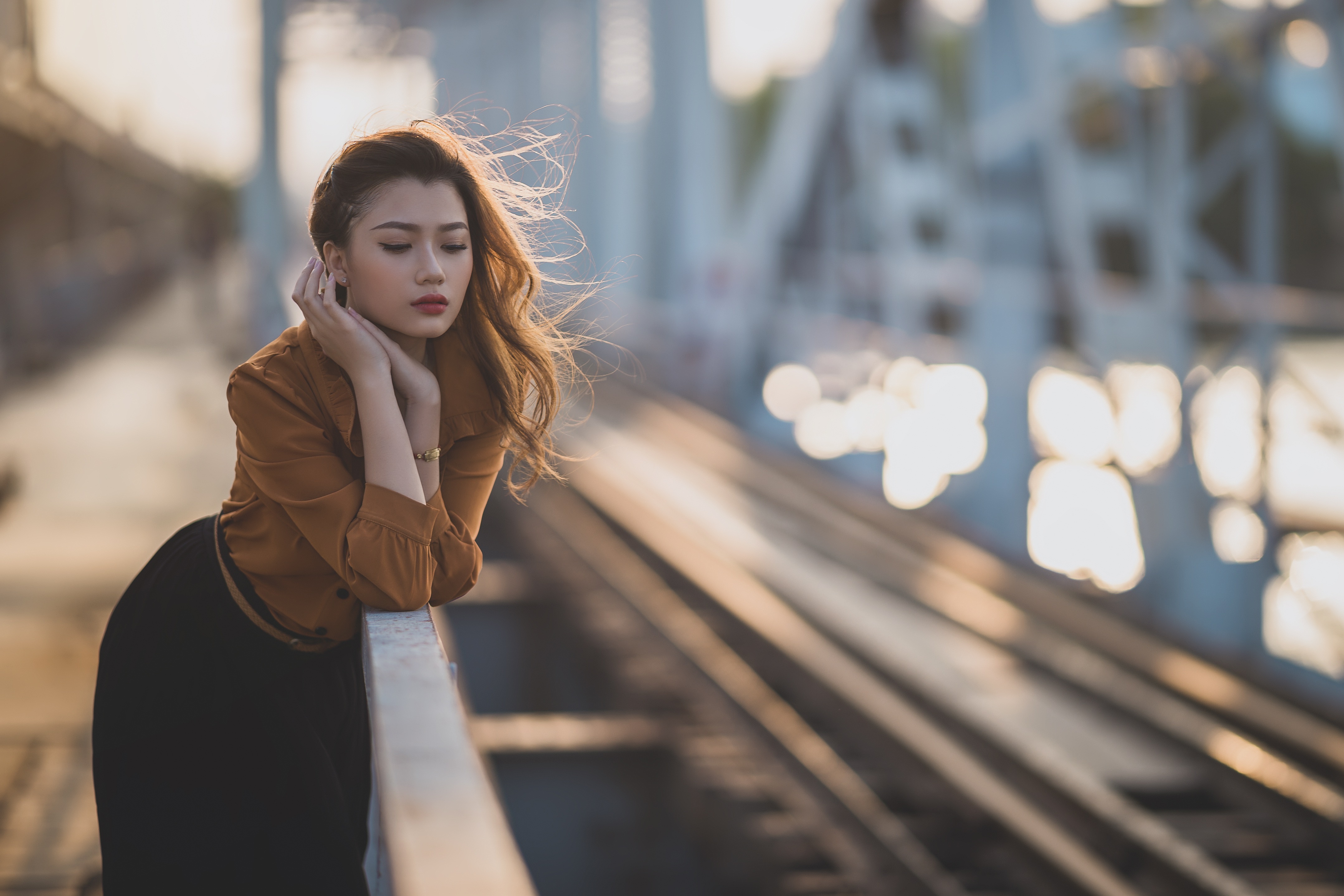 Asian woman on a bridge at sunset HD Wallpaper