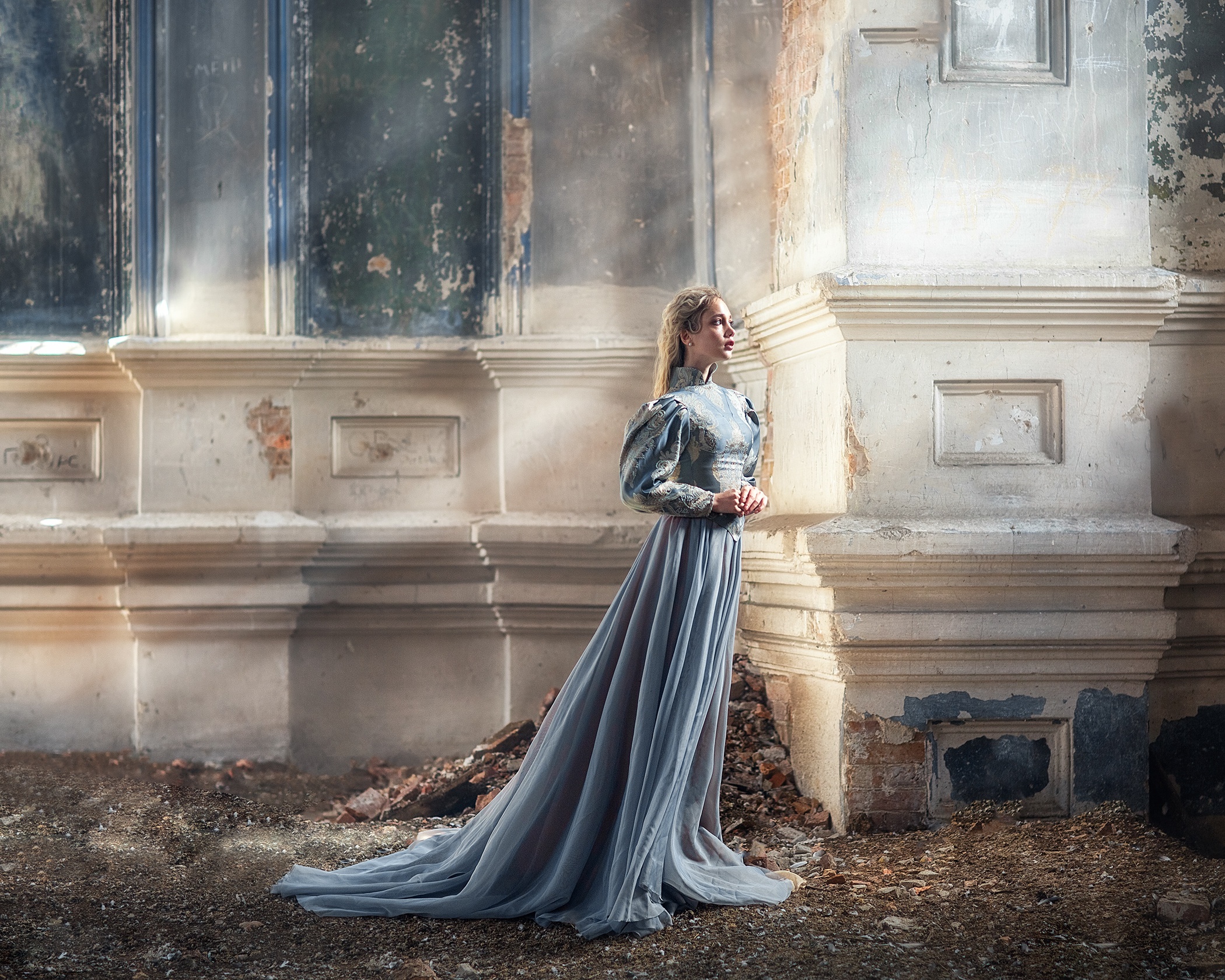 Woman in blue dress in ruined building HD Wallpaper
