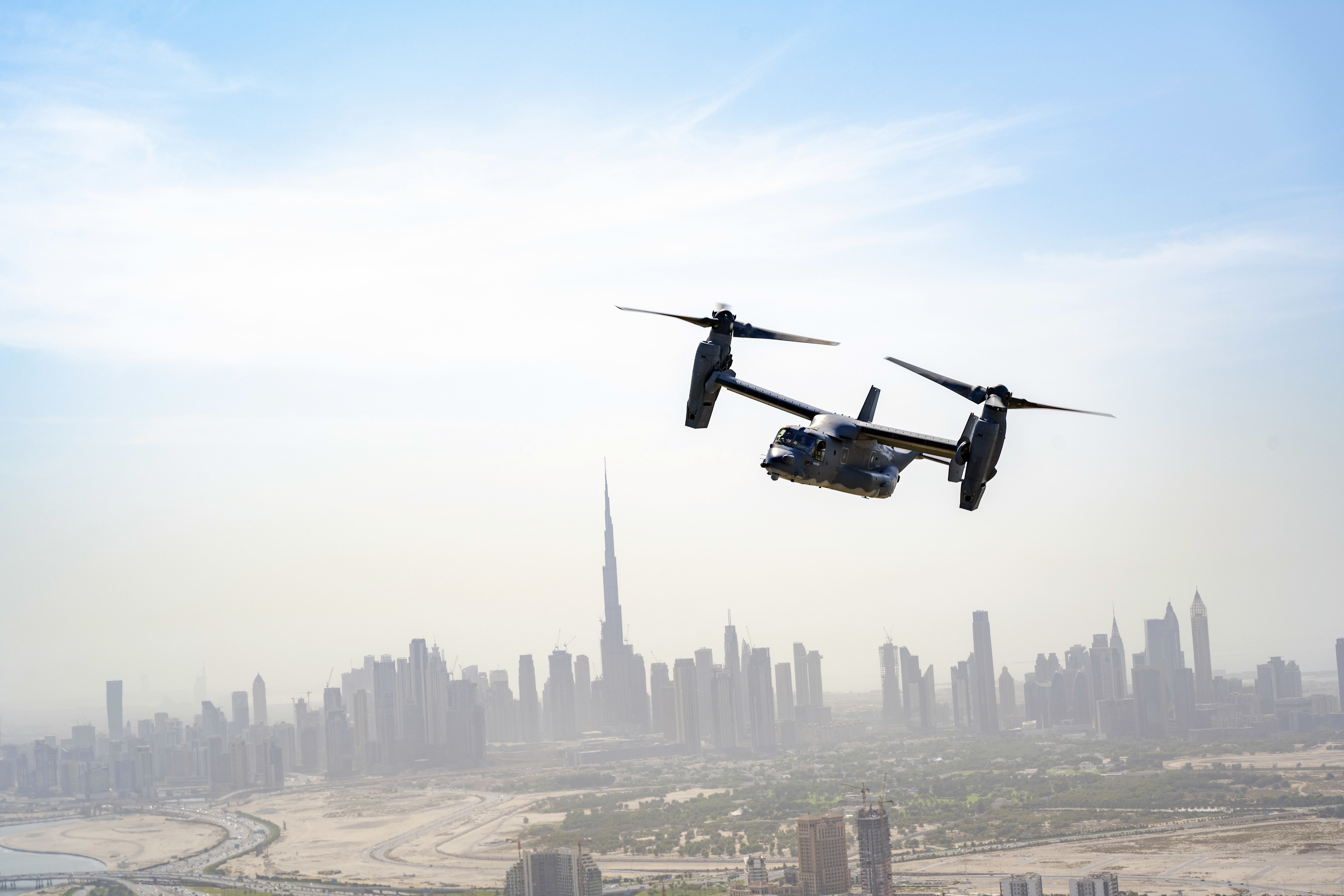 Bell Boeing V-22 Osprey flying over Dubai skyline HD Wallpaper
