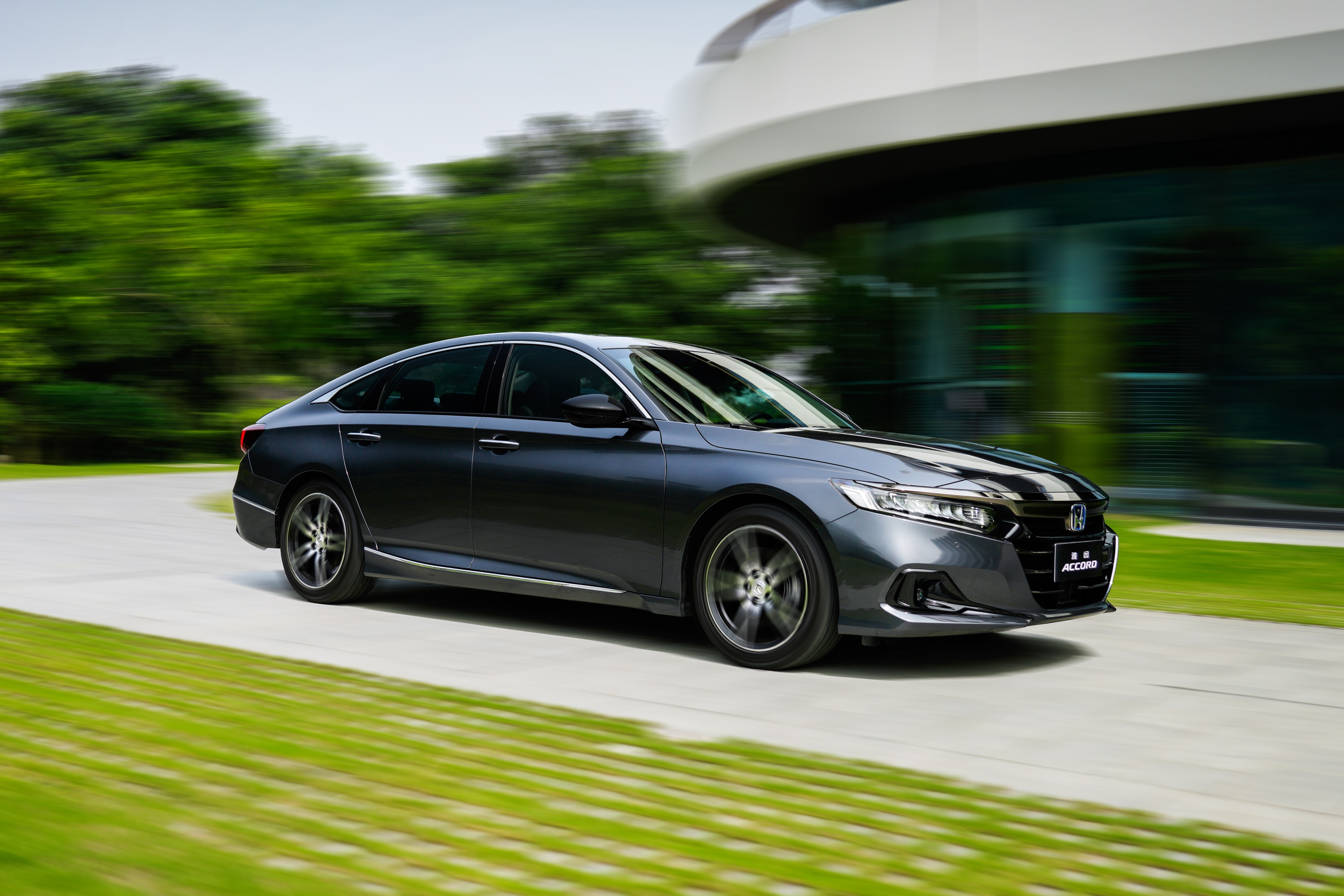 Dark gray Honda Accord Sport Hybrid driving on a road HD Wallpaper