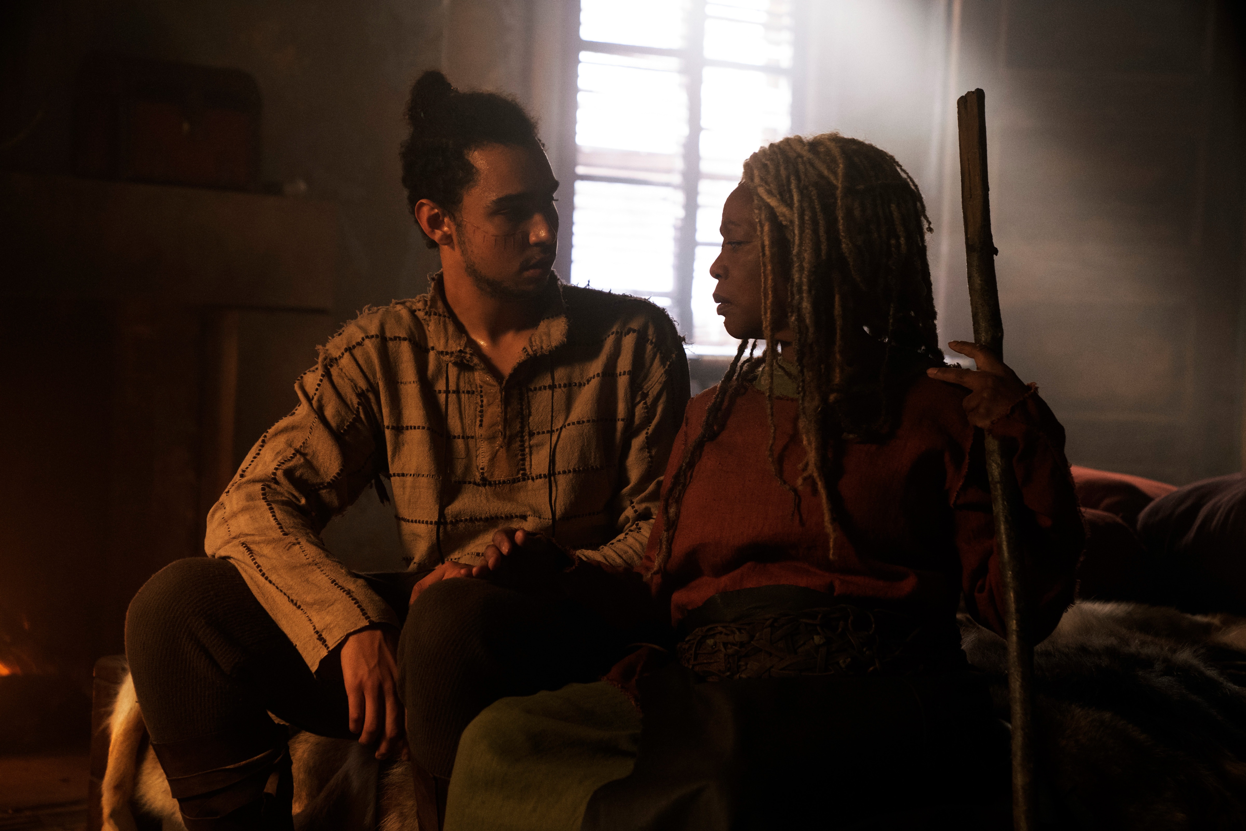 Alfre Woodard and Archie Madekwe in a dimly lit room HD Wallpaper