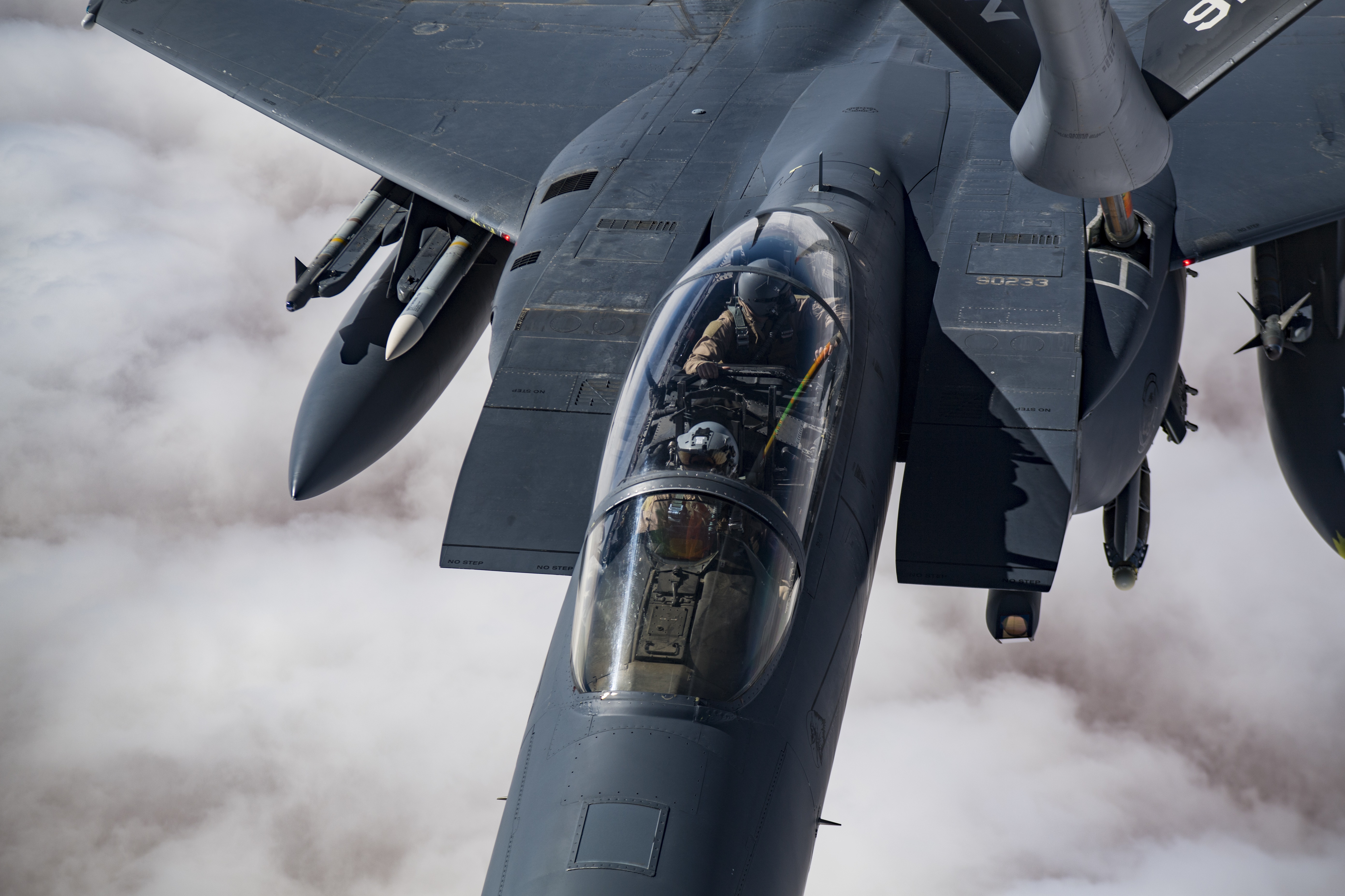 F-15E Strike Eagle receives in-flight fuel HD Wallpaper
