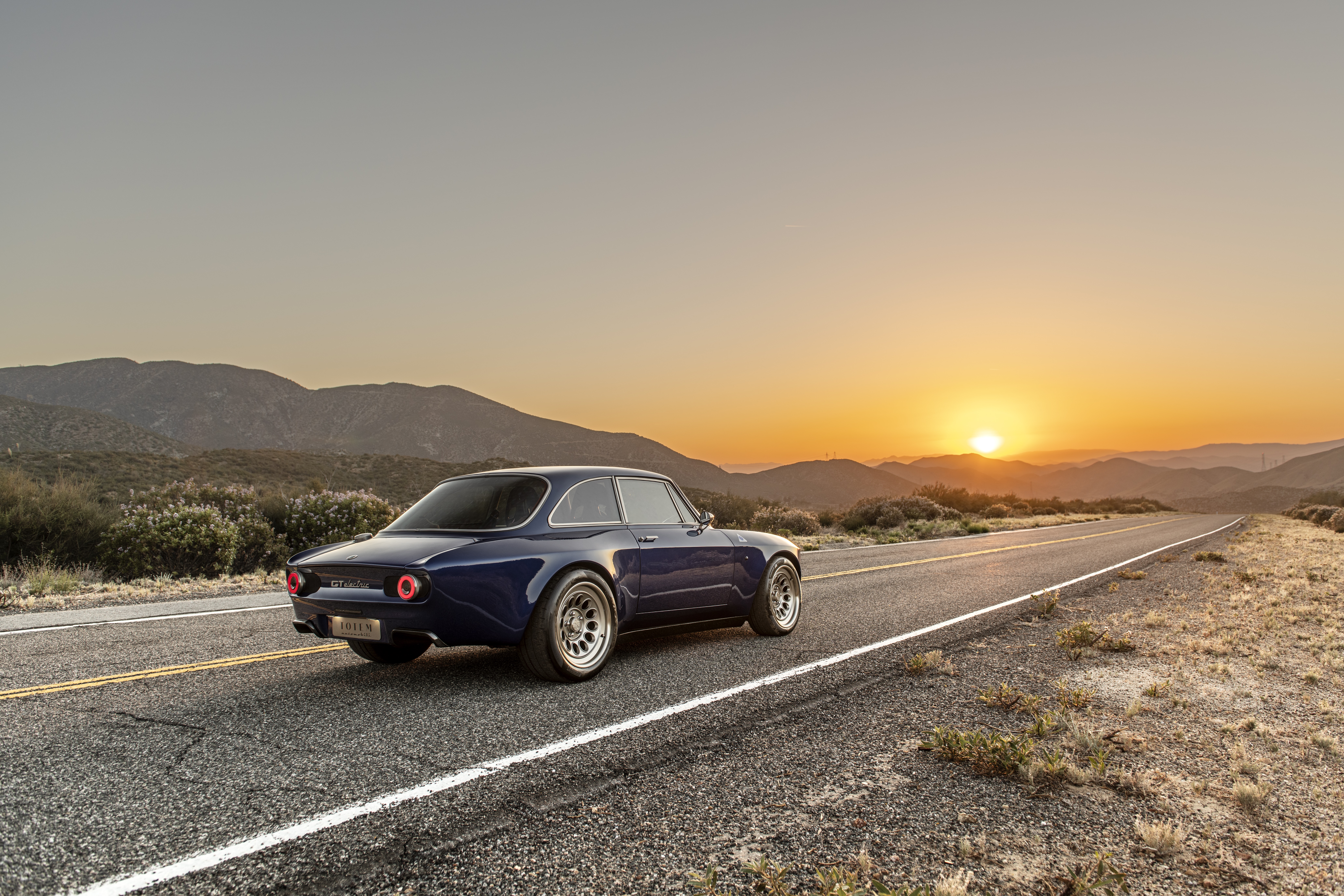 Totem Automobili GT Electric car on a road at sunset HD Wallpaper