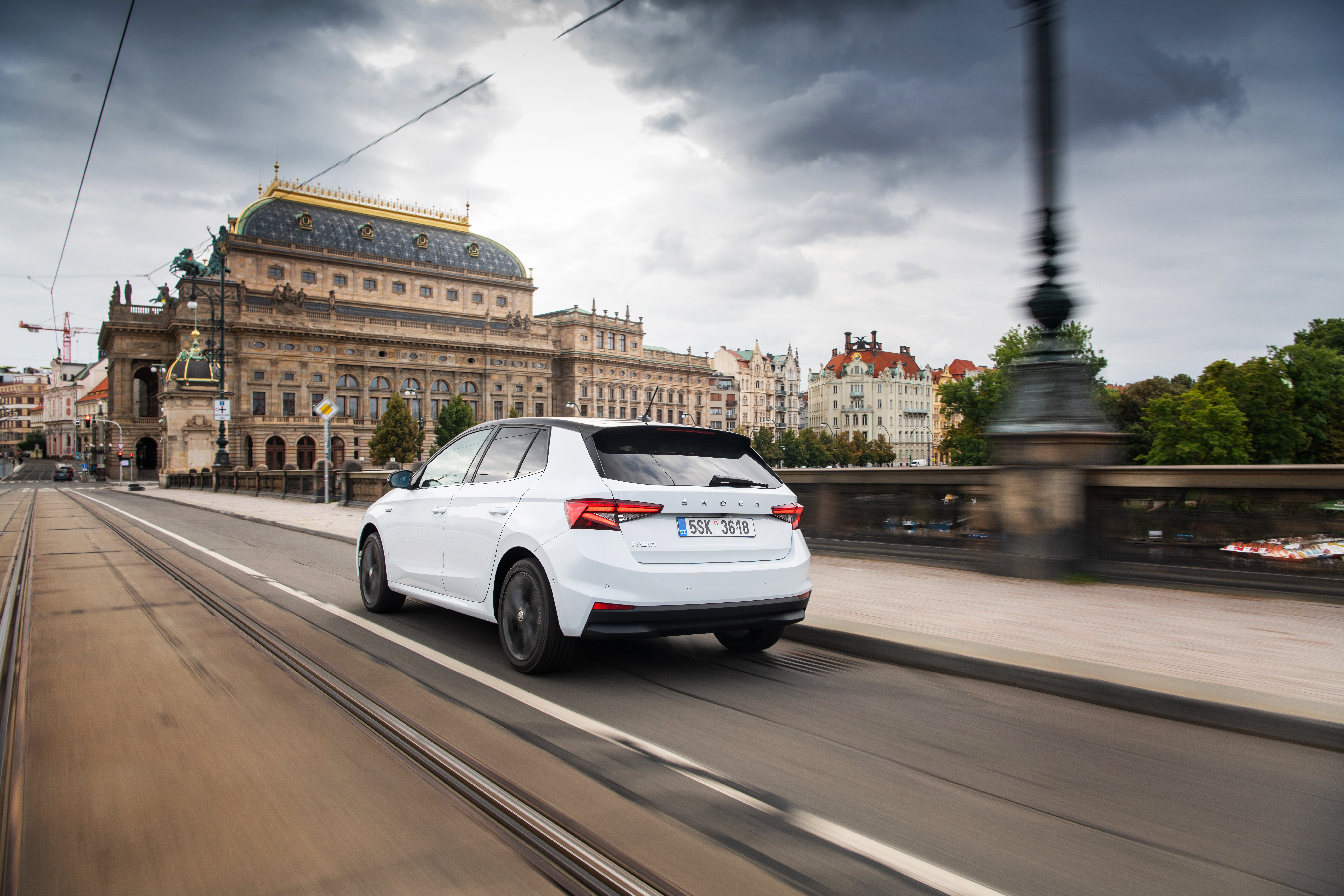 White Skoda Fabia driving on a bridge in Prague HD Wallpaper