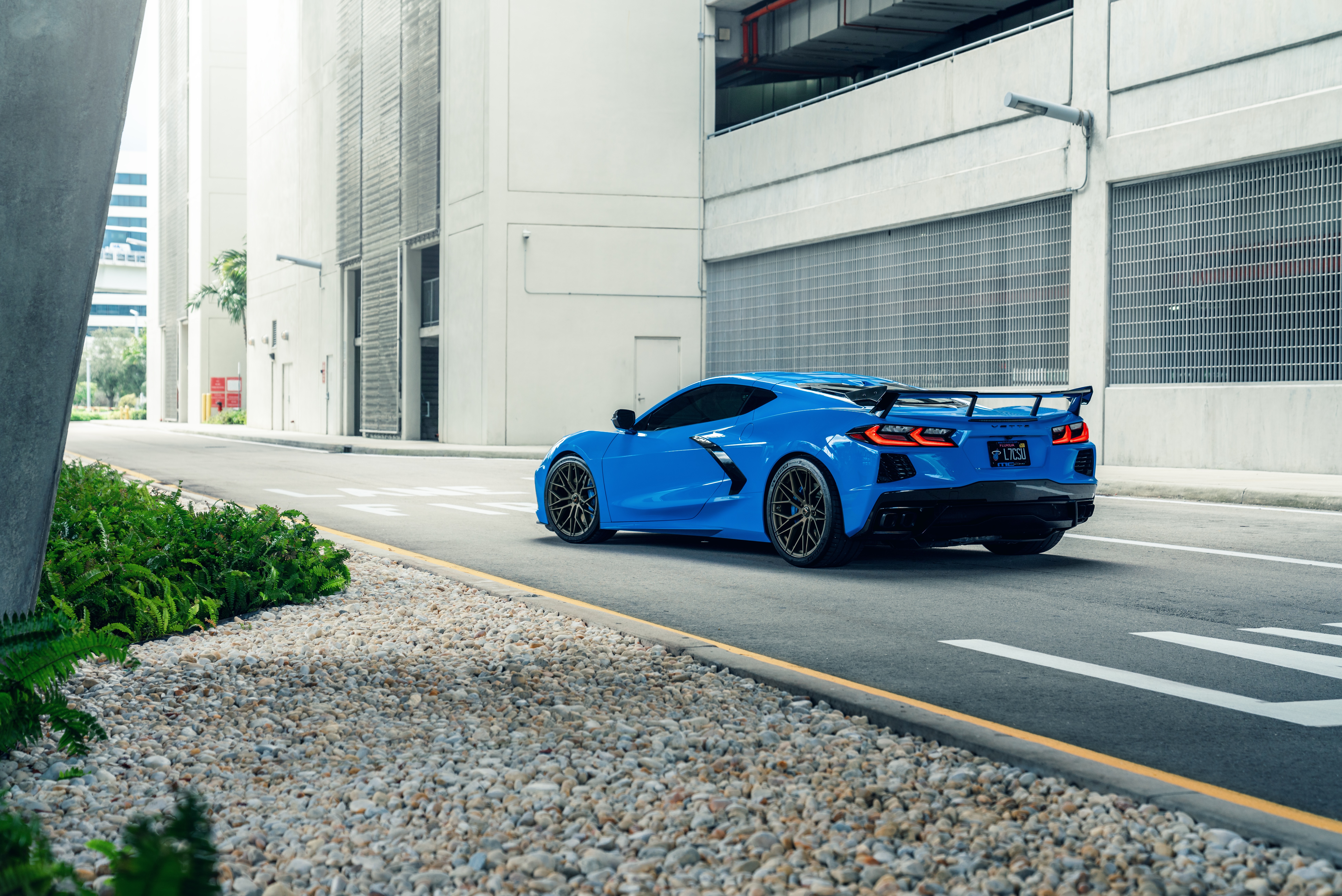 Blue Chevrolet Corvette C8 on a street HD Wallpaper