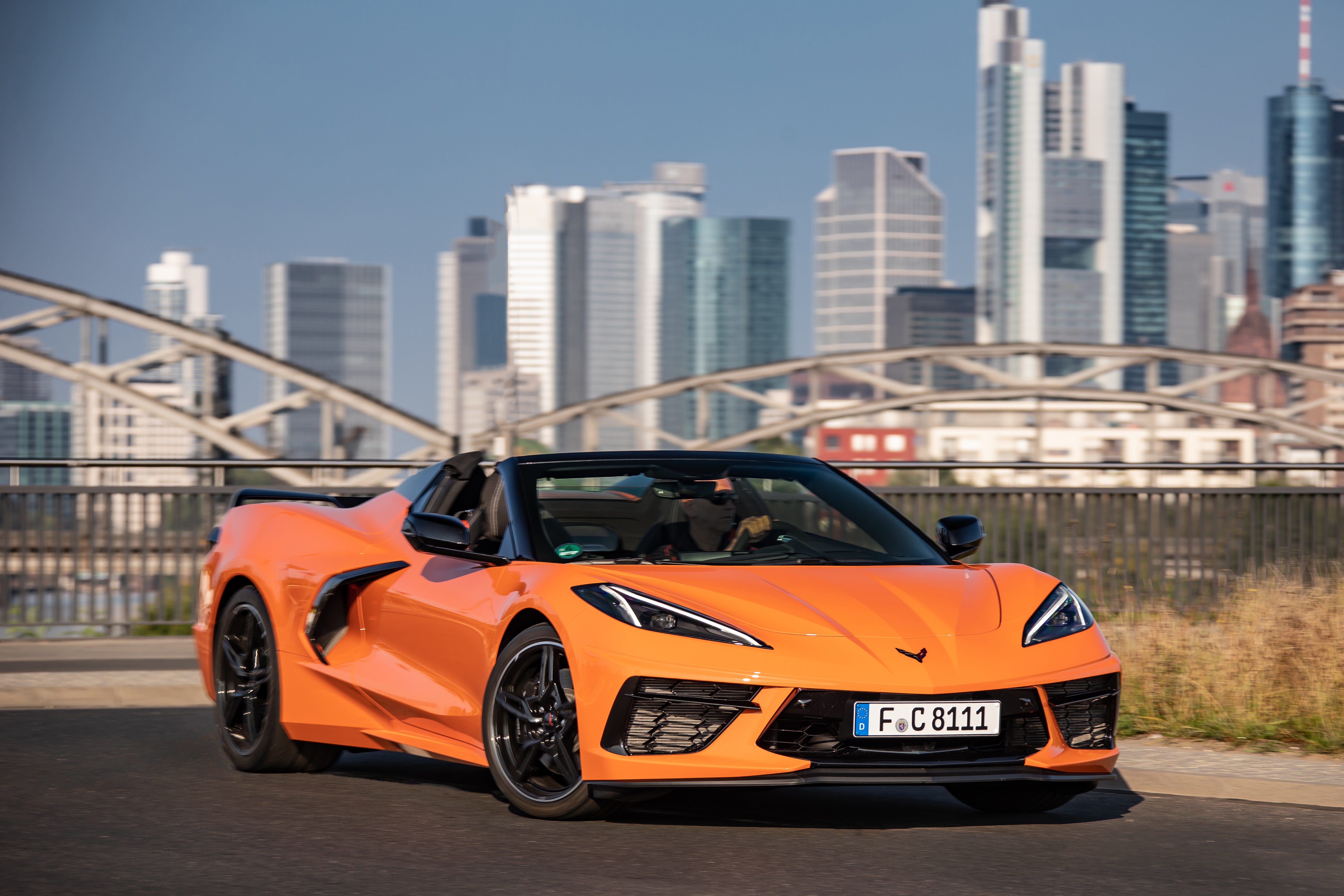 Orange Chevrolet Corvette Stingray Convertible on a bridge HD Wallpaper