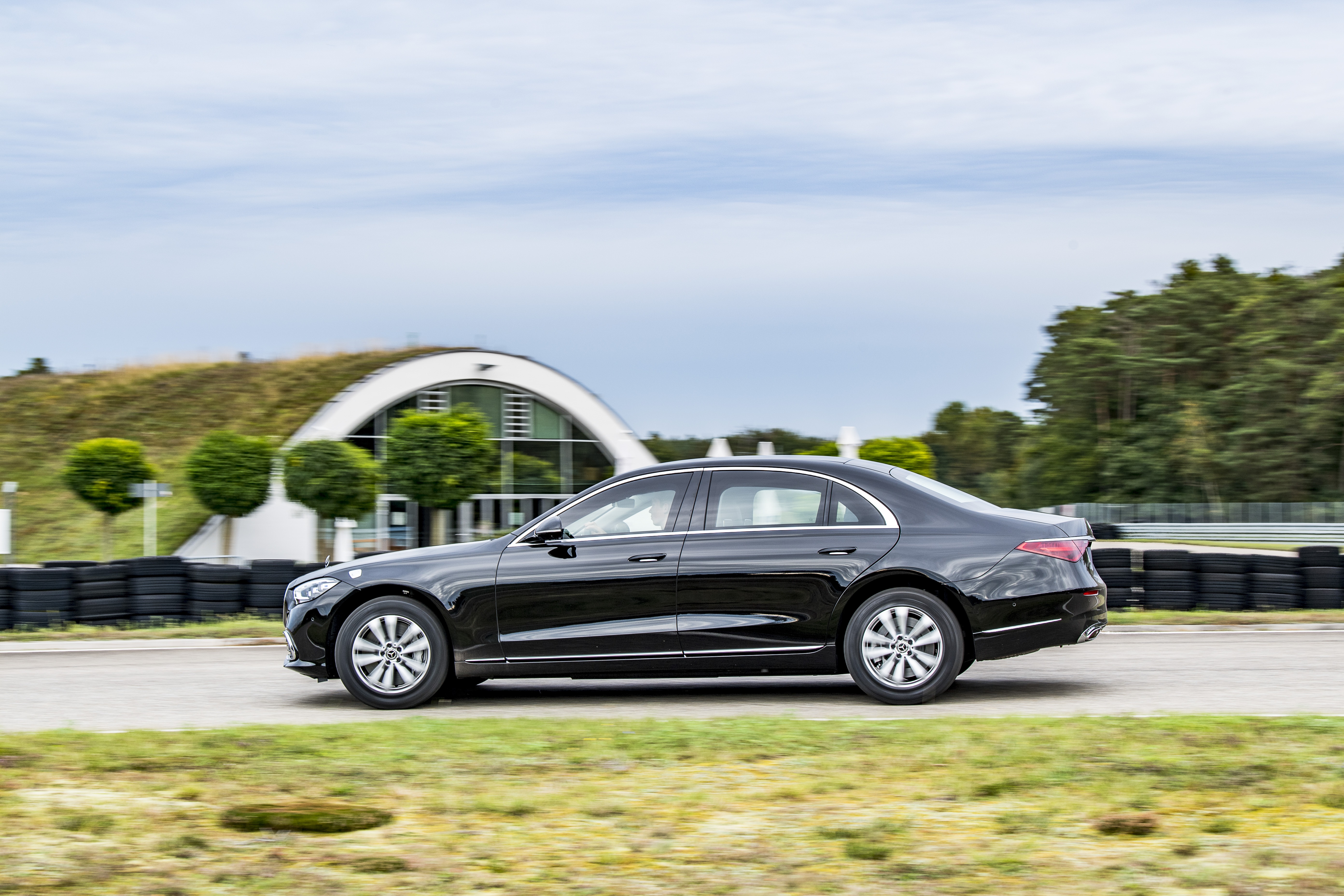 Black Mercedes-Benz S-Class driving on a track HD Wallpaper
