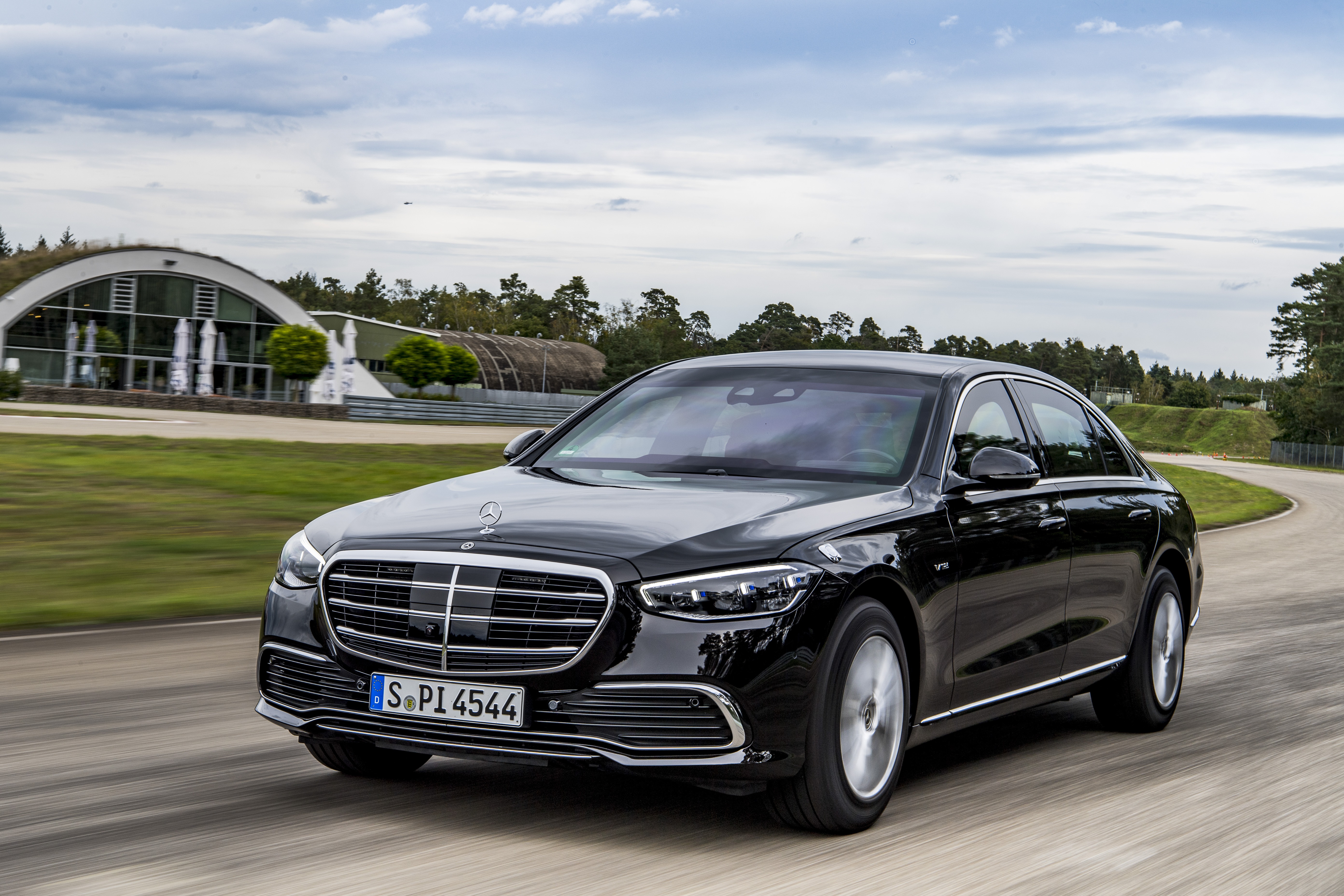 Black Mercedes-Benz S-Class driving on a track HD Wallpaper