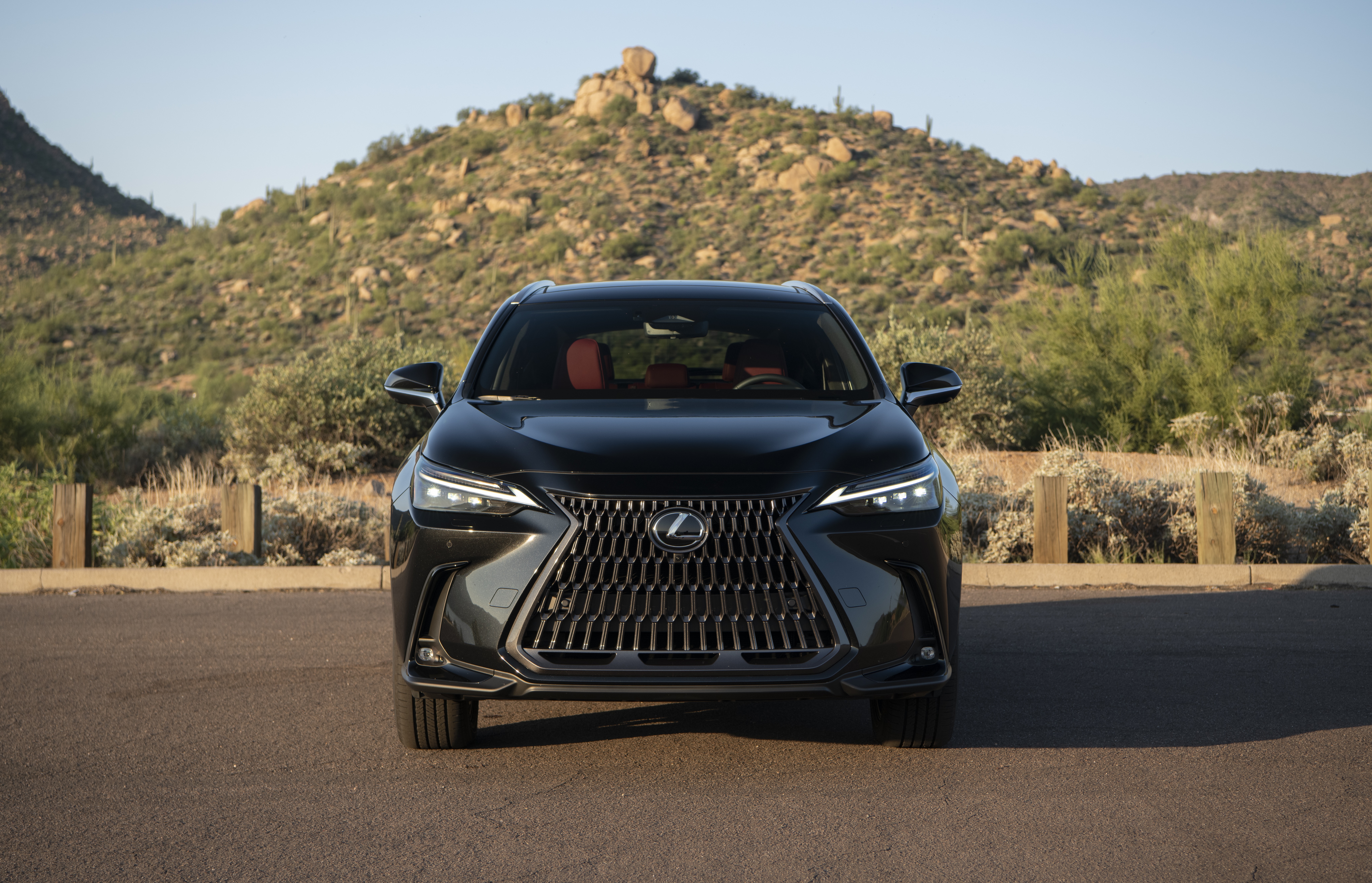 Black Lexus NX 350 AWD parked in desert landscape HD Wallpaper