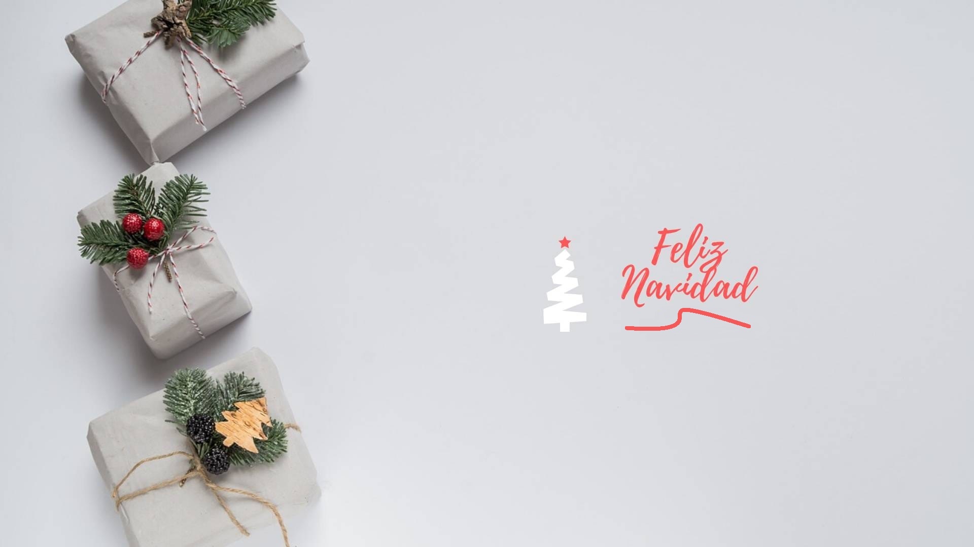 Christmas gifts with Feliz Navidad text HD Wallpaper
