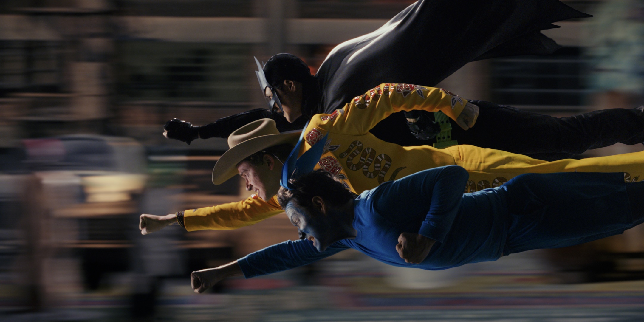 Three men in costumes flying HD Wallpaper