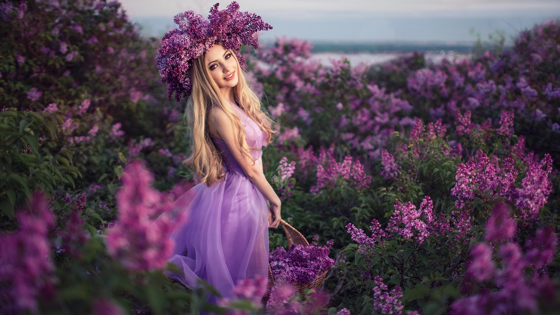 Woman with lilac wreath in lilac garden HD Wallpaper