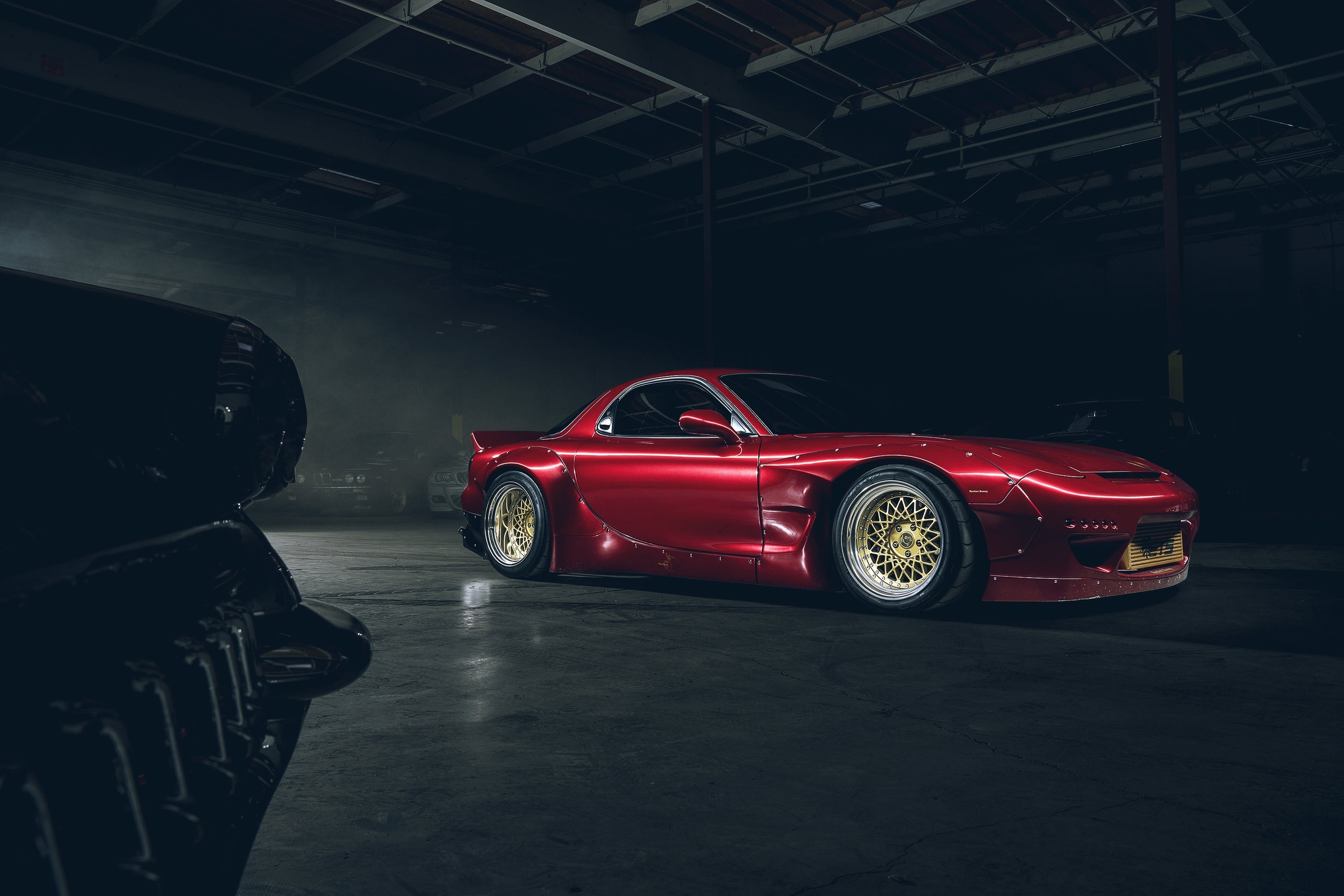 Red Mazda RX-7 with widebody kit and gold wheels HD Wallpaper