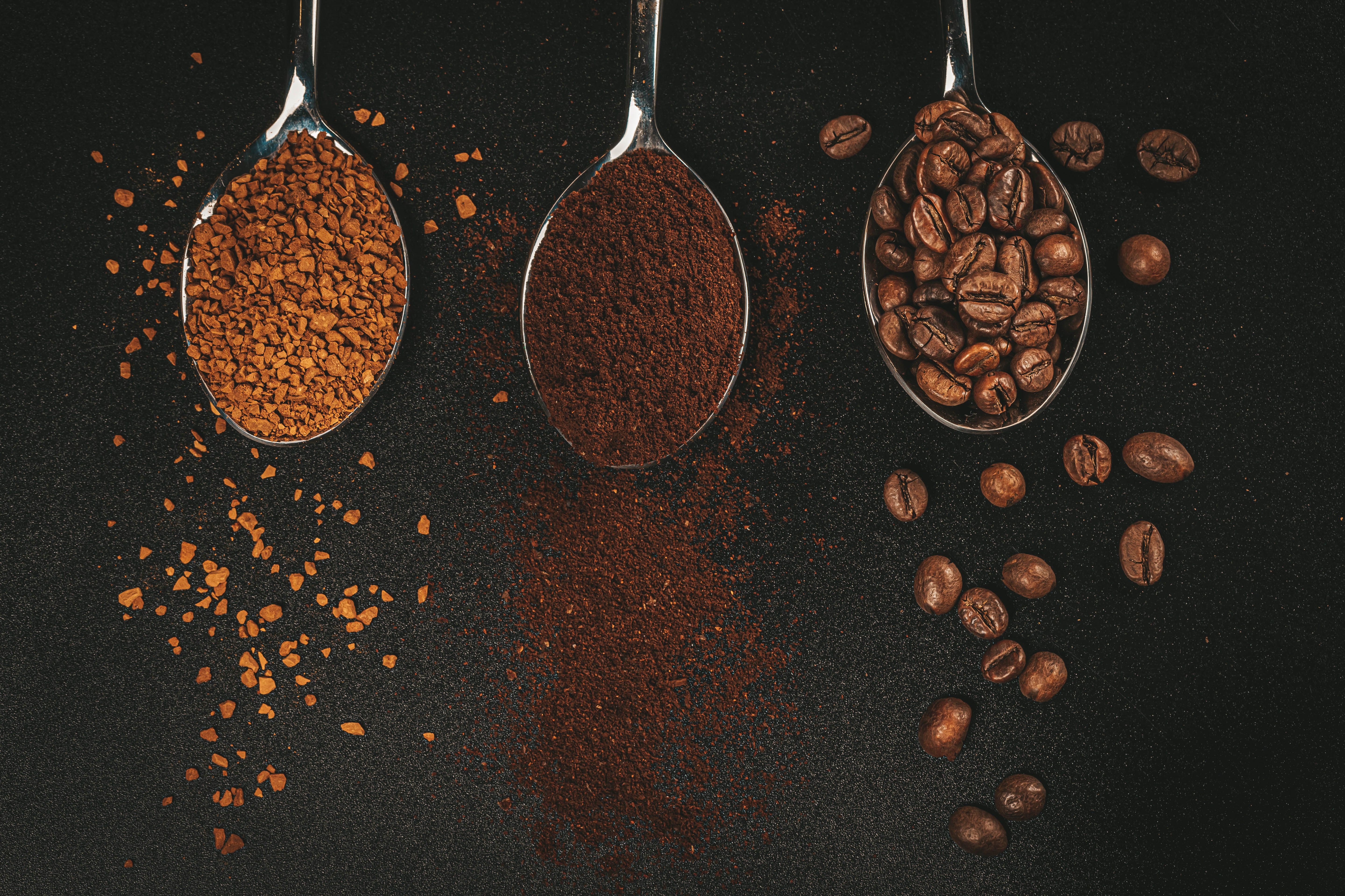 Three spoons of coffee: instant, ground, and beans HD Wallpaper