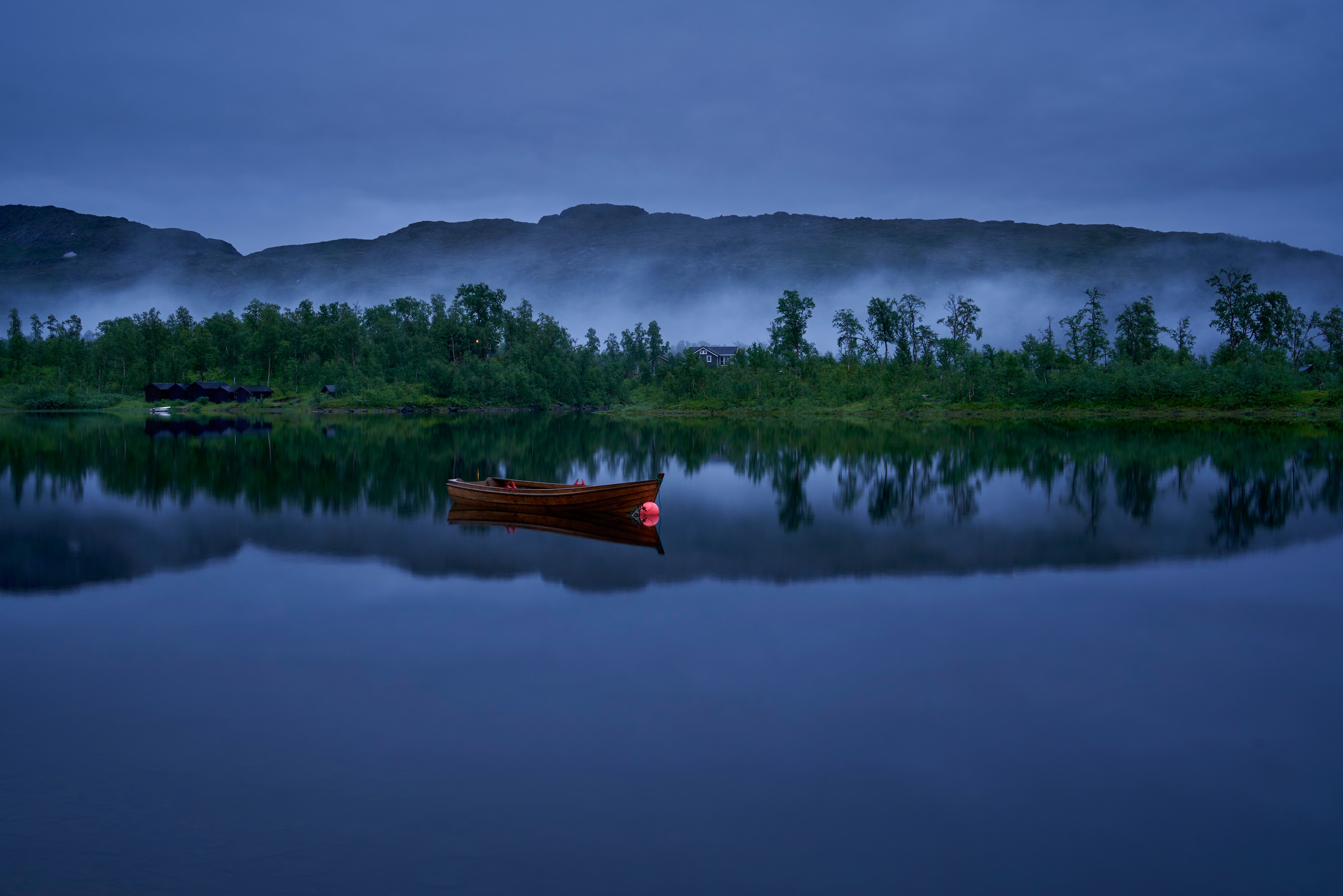 Wooden boat with red buoy on a lake in Norway HD Wallpaper